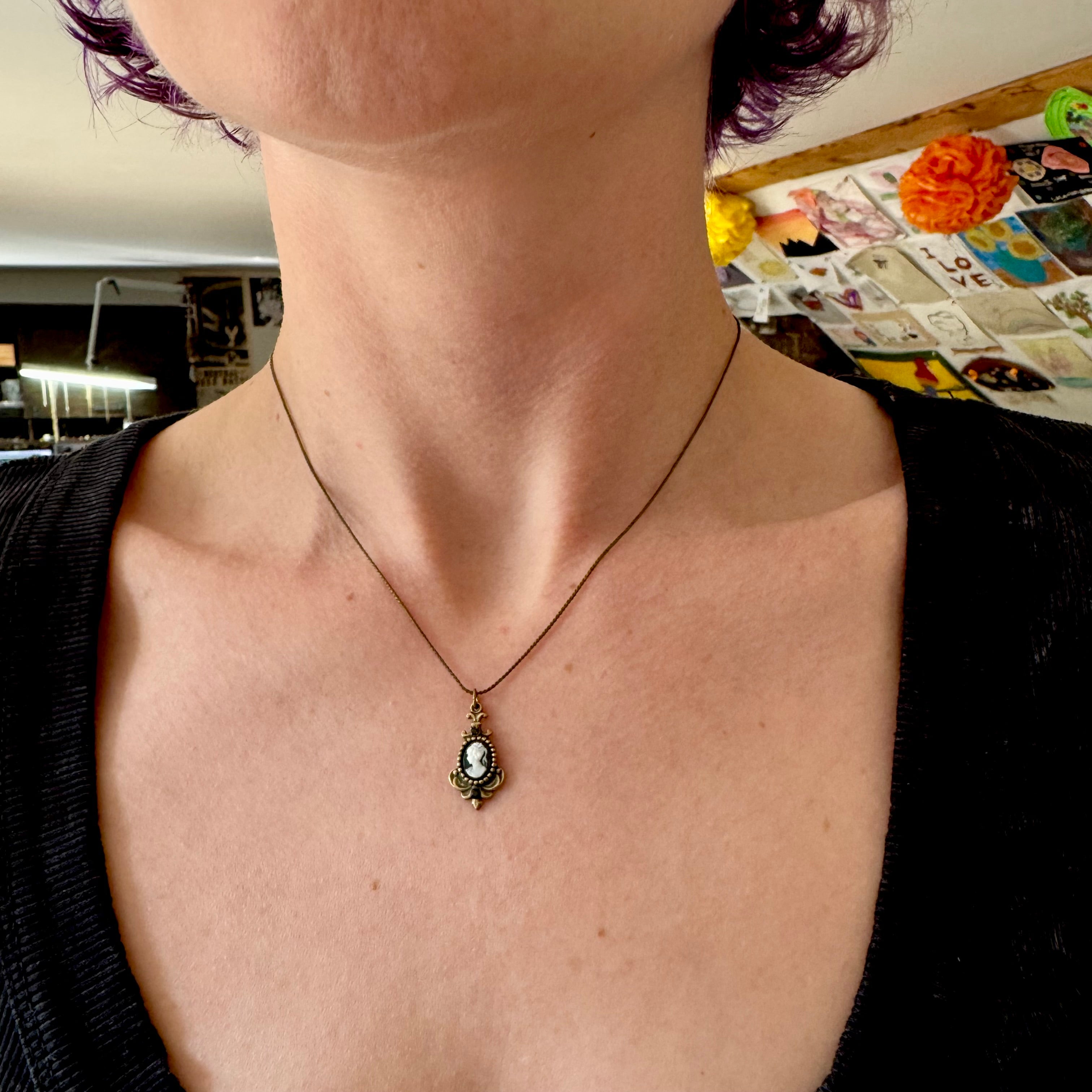 Retro Michal Negrin black & white cameo brass necklace