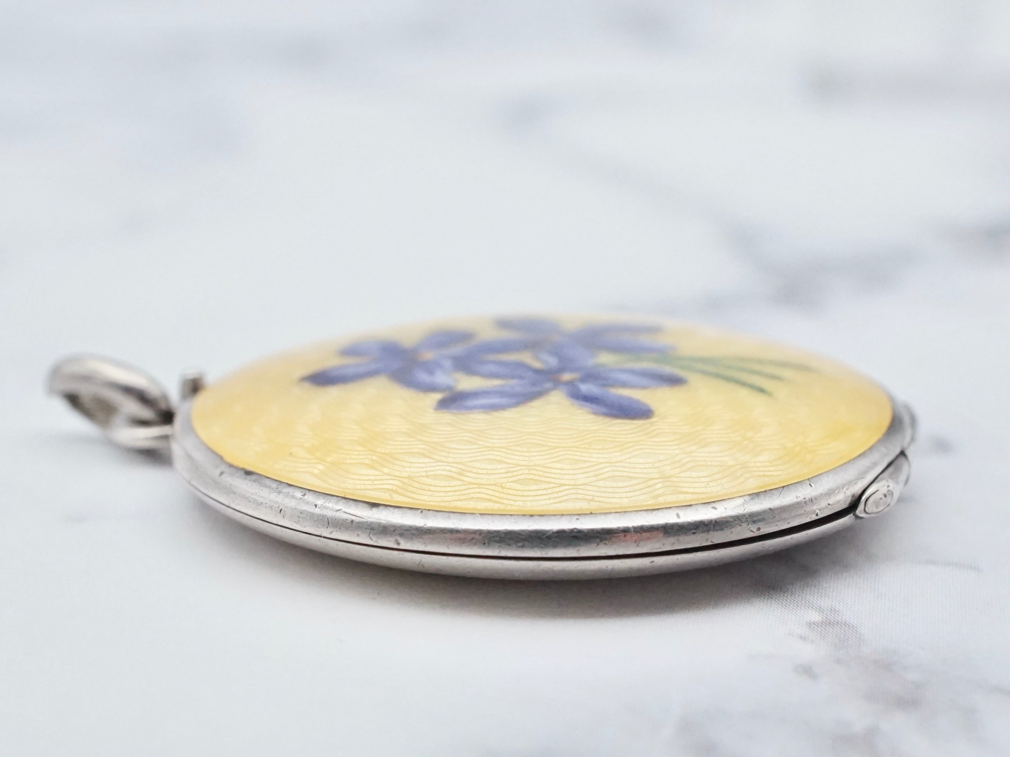 Antique .900 silver hand-painted yellow guilloche enamel locket with purple flowers