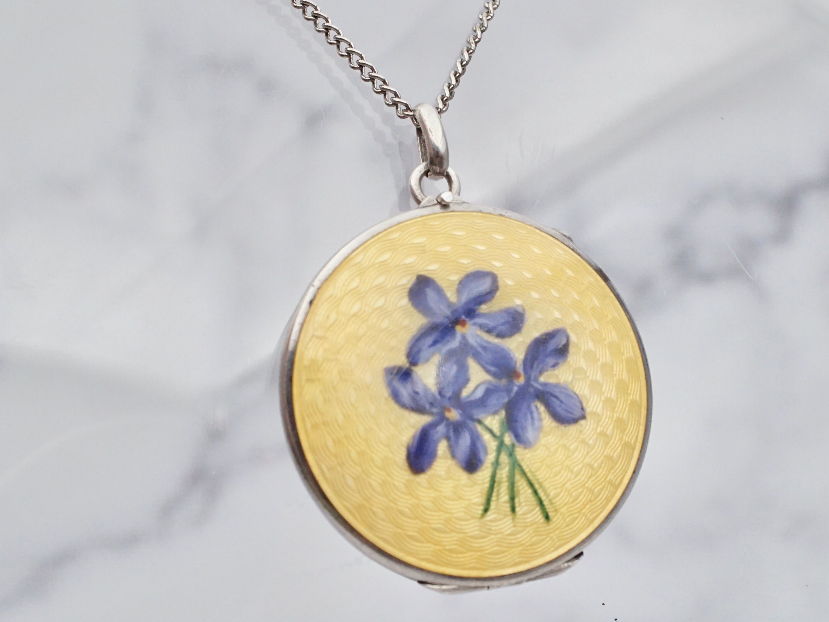 Antique .900 silver hand-painted yellow guilloche enamel locket with purple flowers