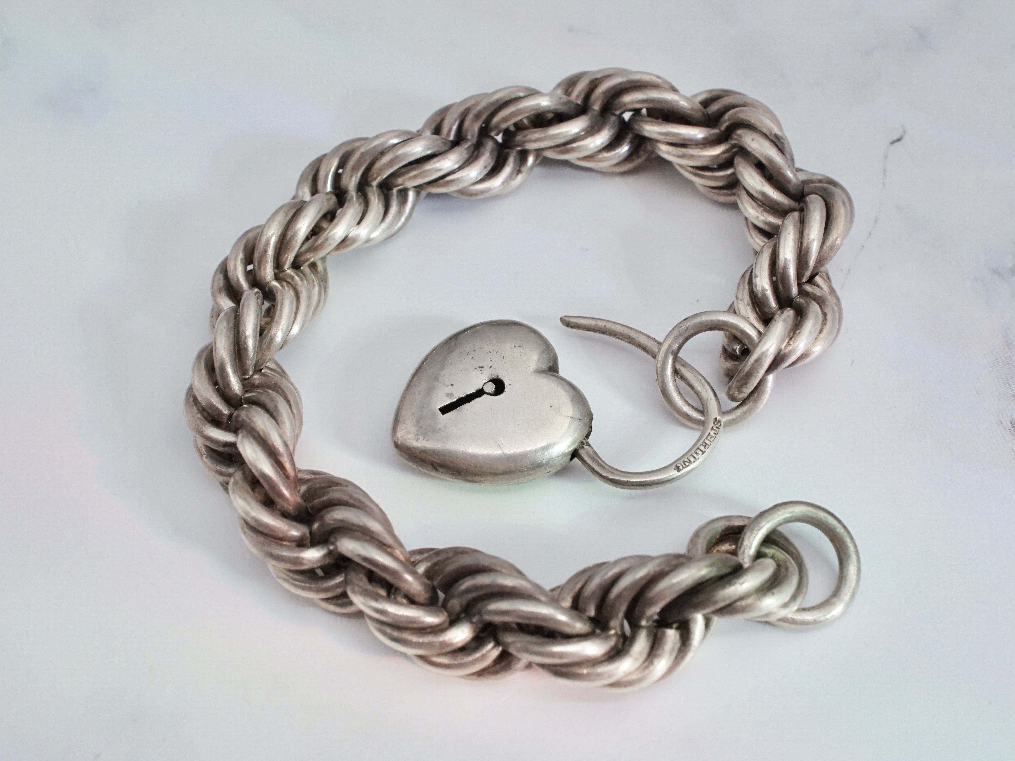 Antique Victorian Simons Brothers sterling rolling rope link bracelet with heart padlock clasp