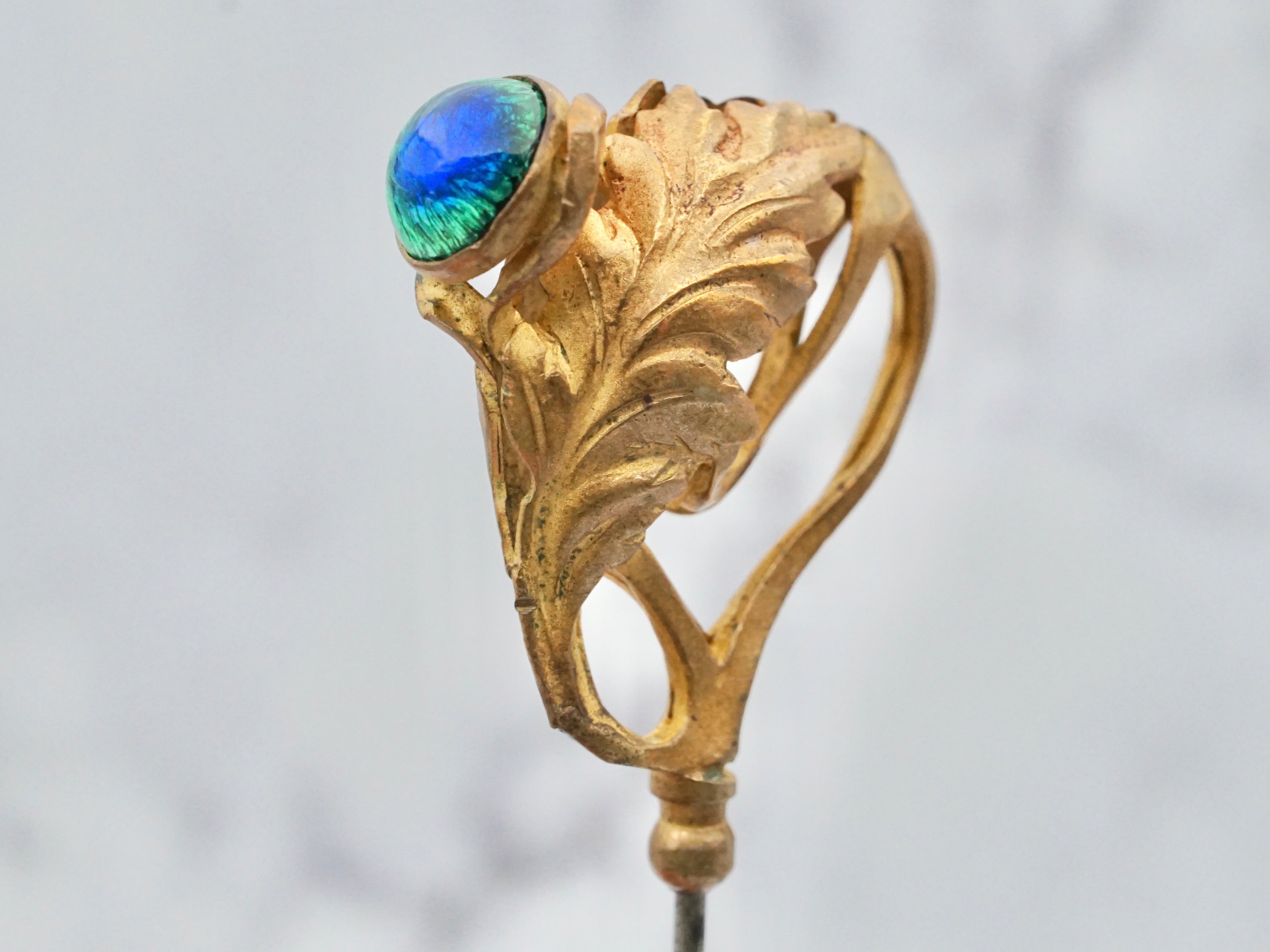 Antique Victorian gilt metal and glass peacock eye stickpin