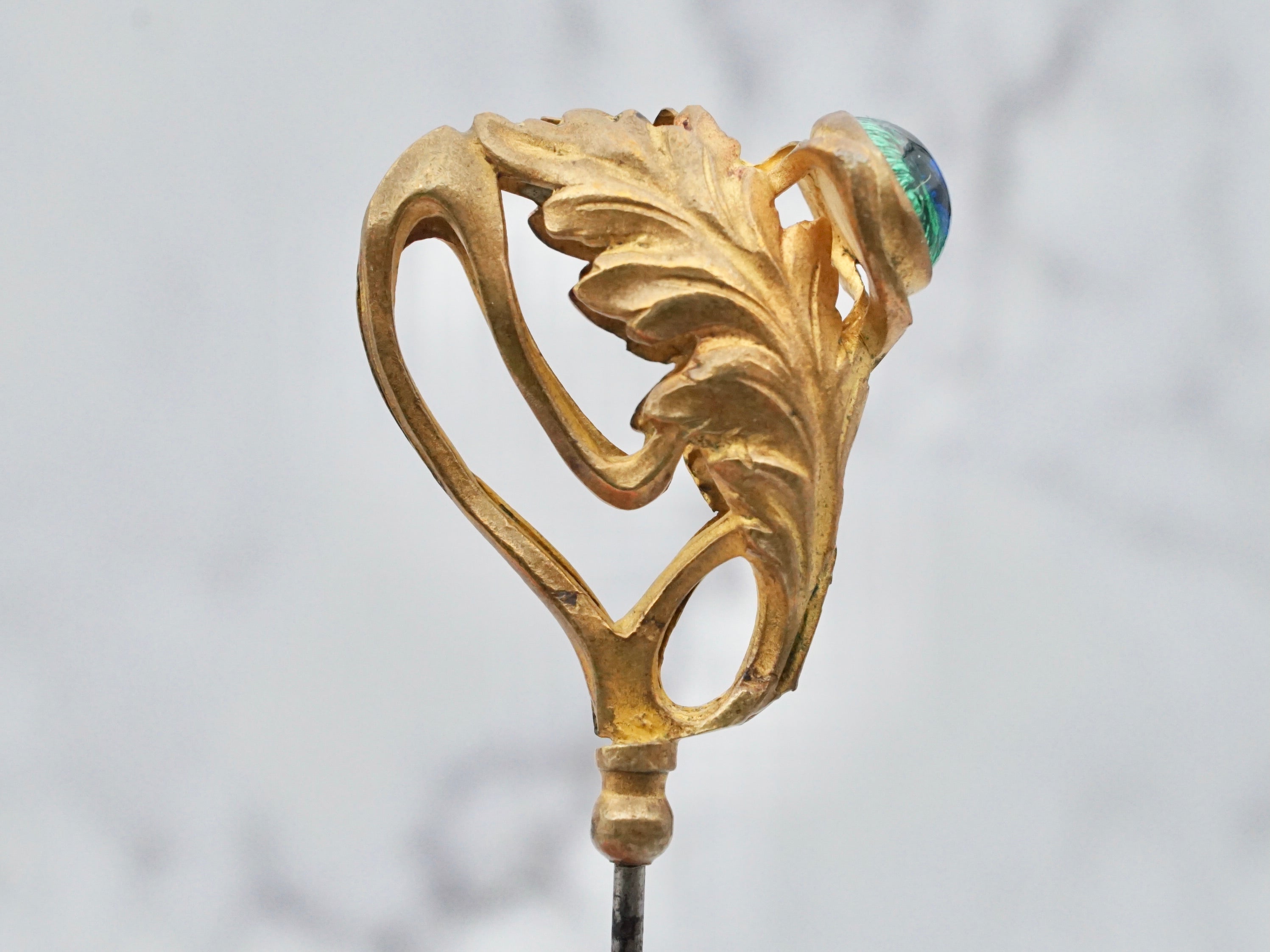 Antique Victorian gilt metal and glass peacock eye stickpin