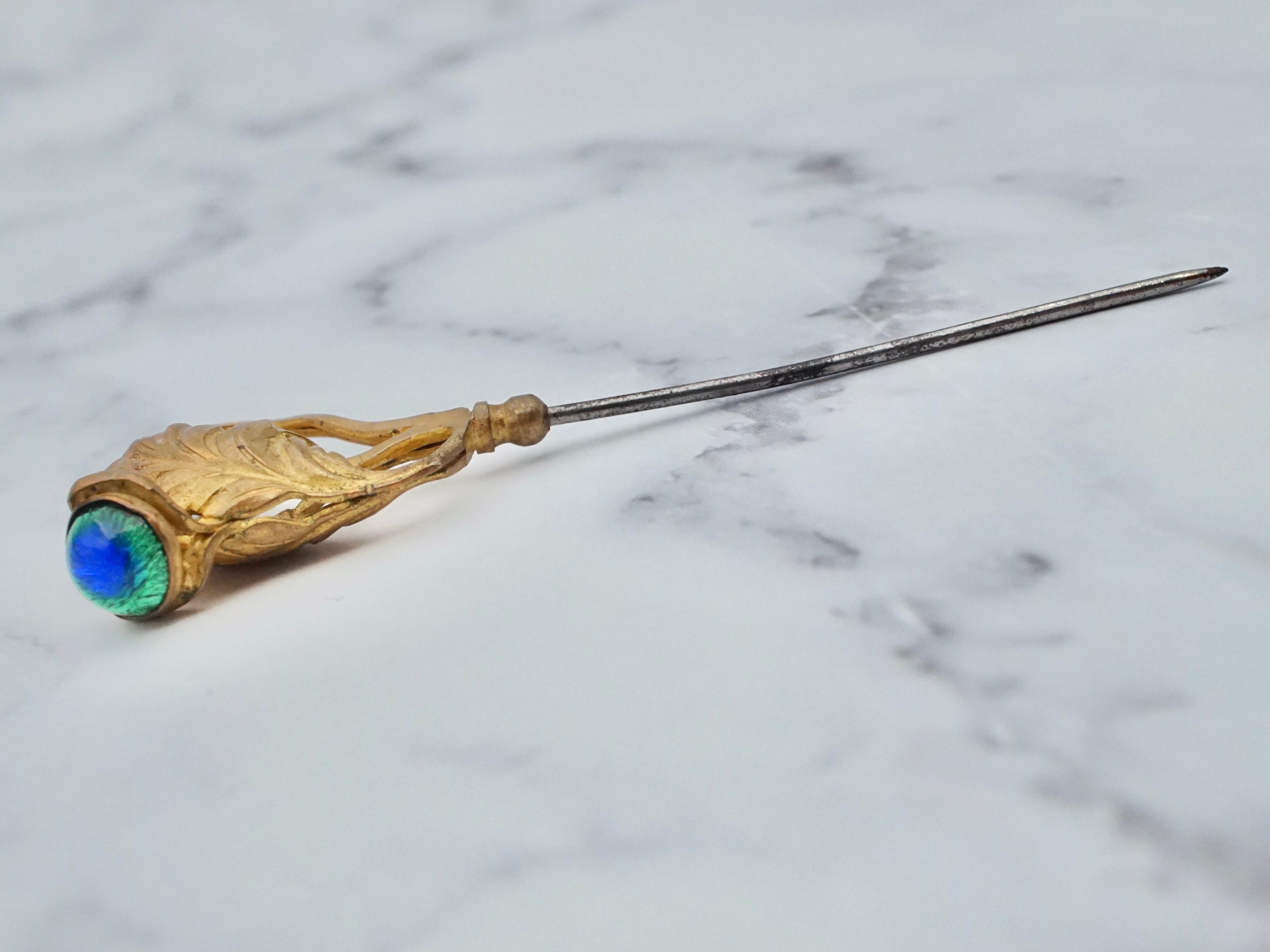 Antique Victorian gilt metal and glass peacock eye stickpin