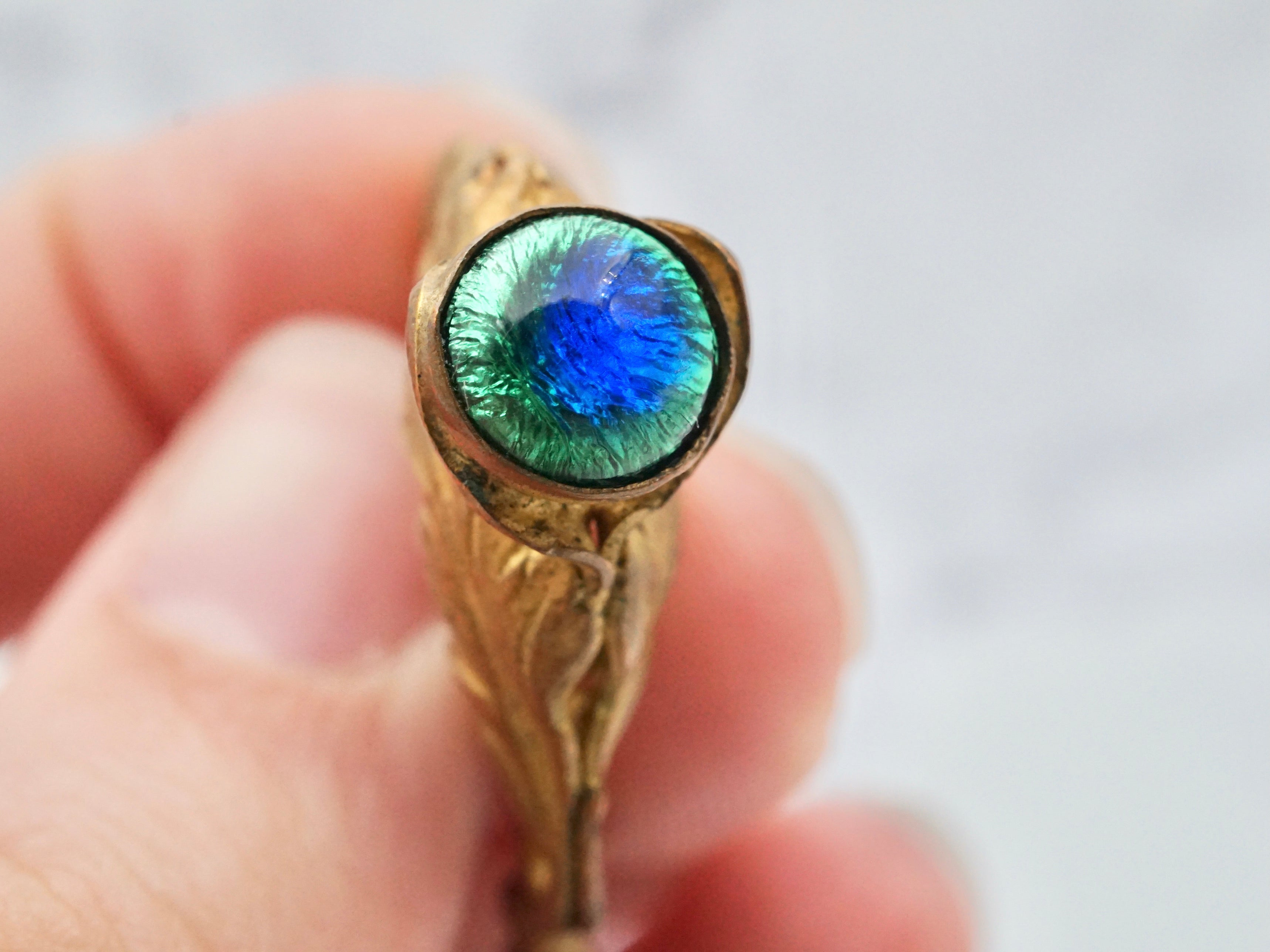 Antique Victorian gilt metal and glass peacock eye stickpin