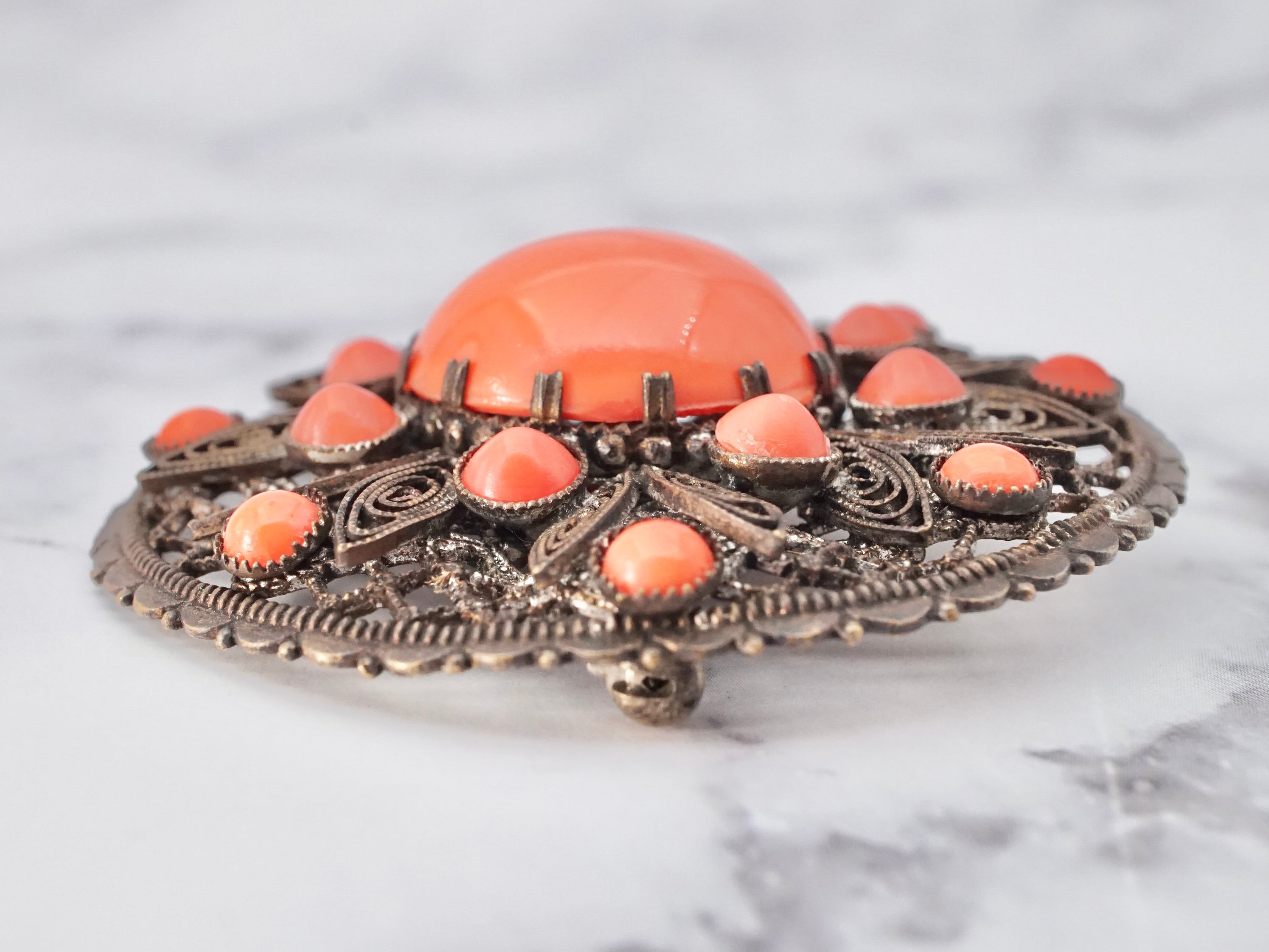 Antique Czech coral glass cabochon metal filigree brooch