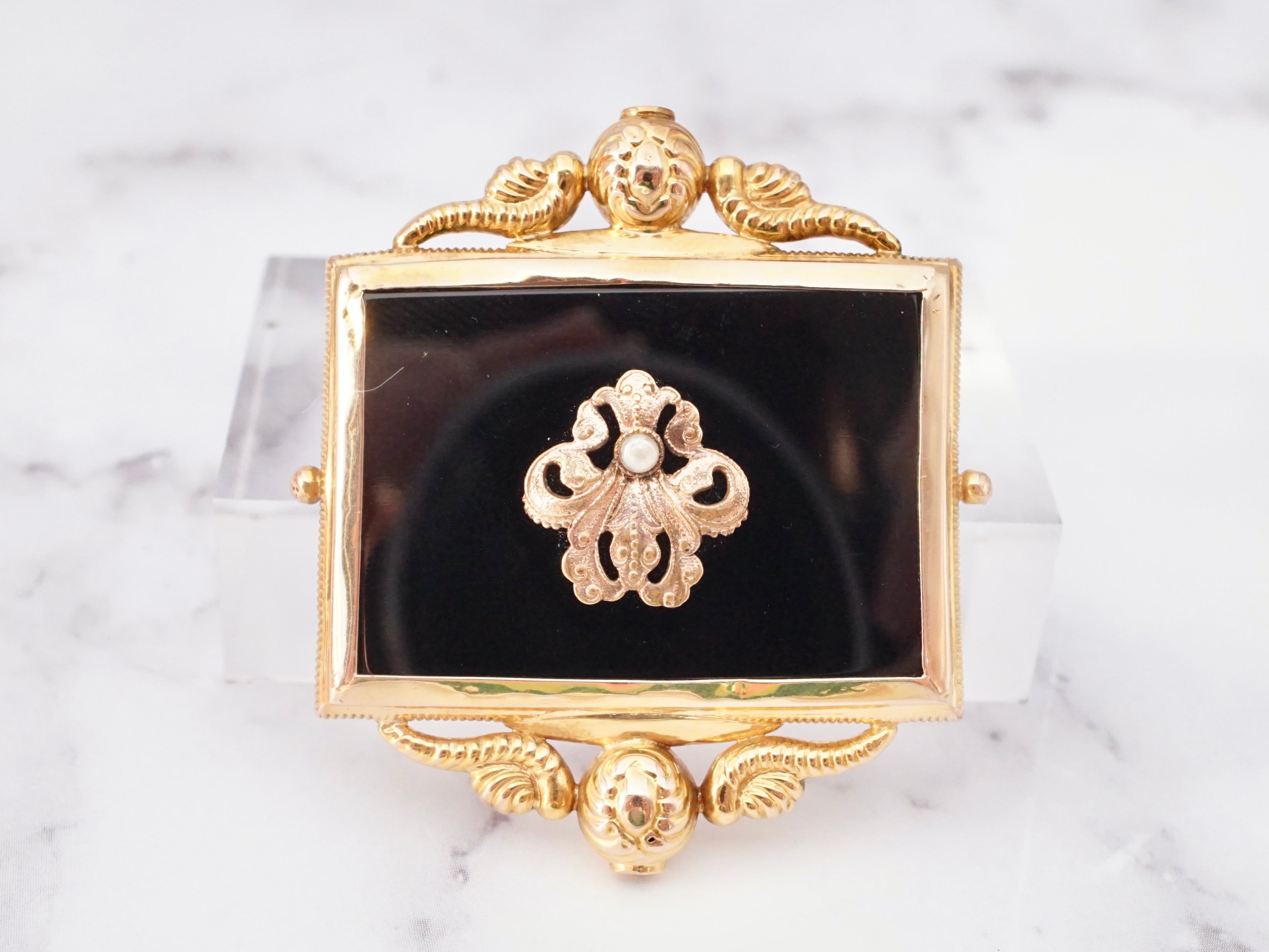 Antique Victorian 10k gold, onyx, and pearl mourning frame brooch