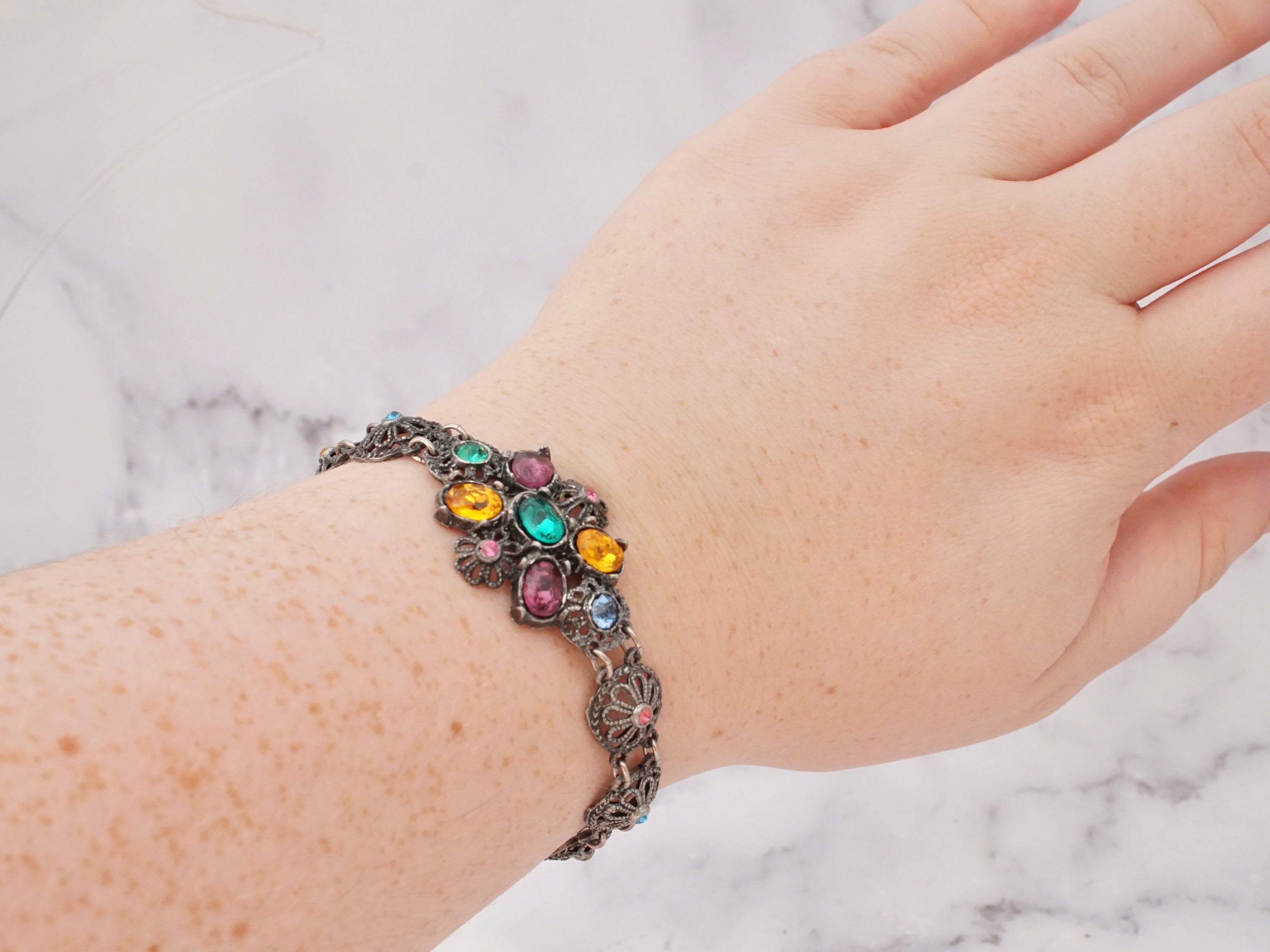 Antique harlequin Czech glass and metal filigree bracelet