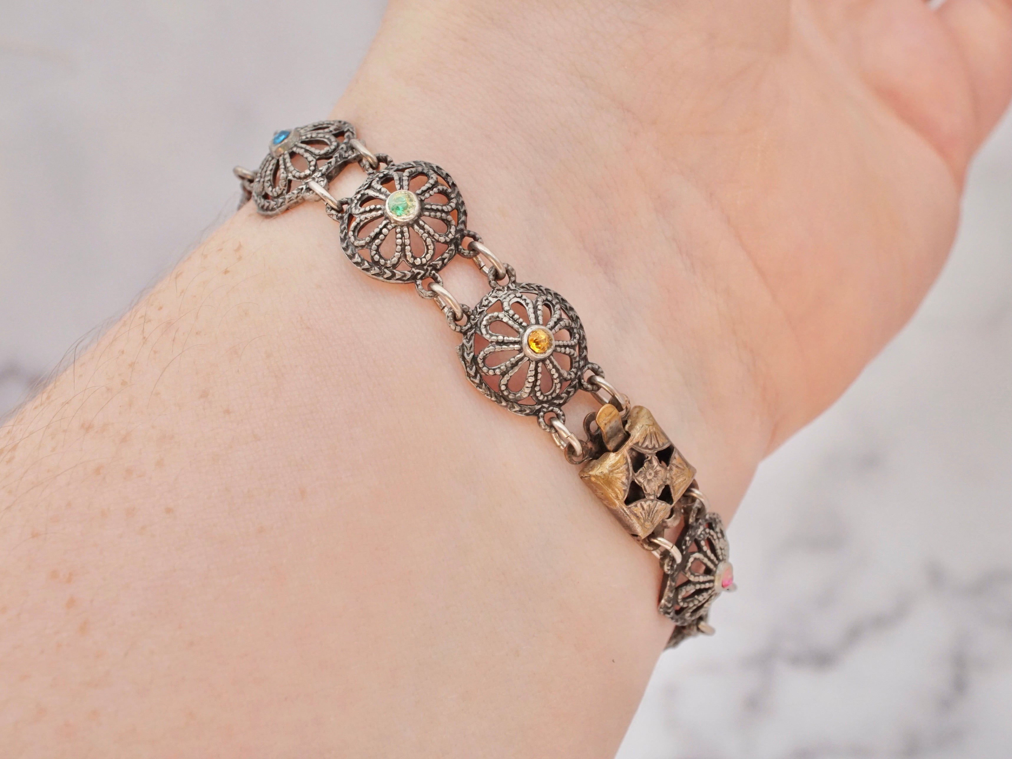 Antique harlequin Czech glass and metal filigree bracelet