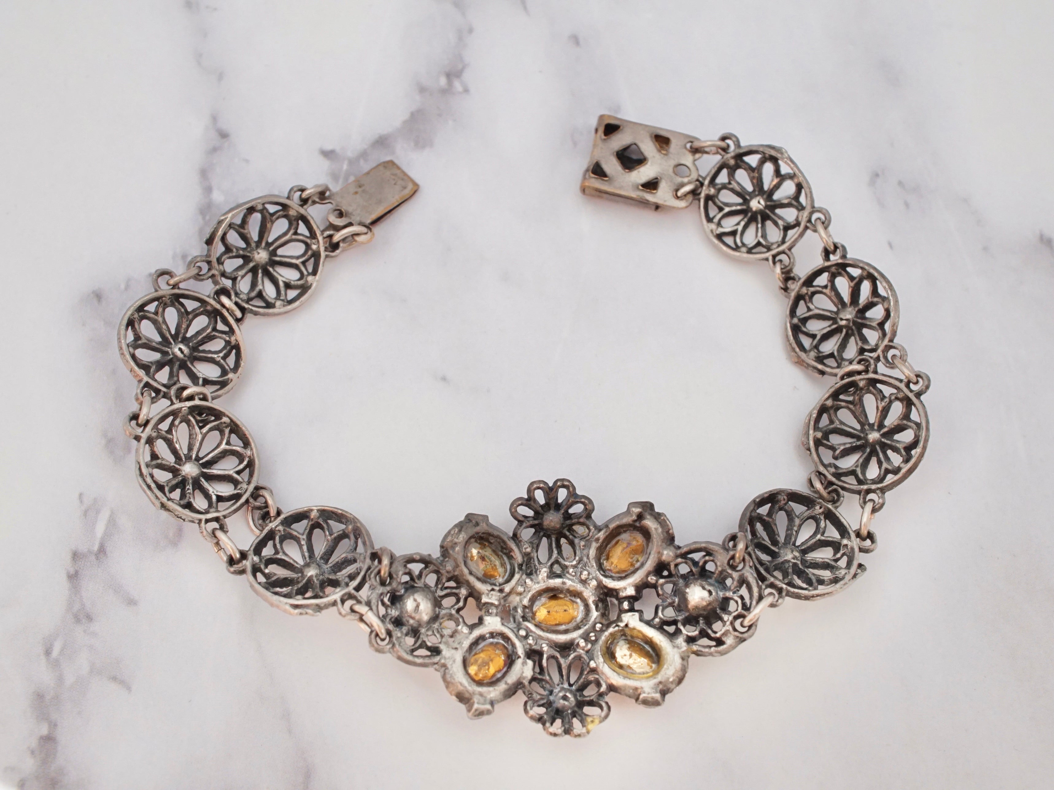 Antique harlequin Czech glass and metal filigree bracelet