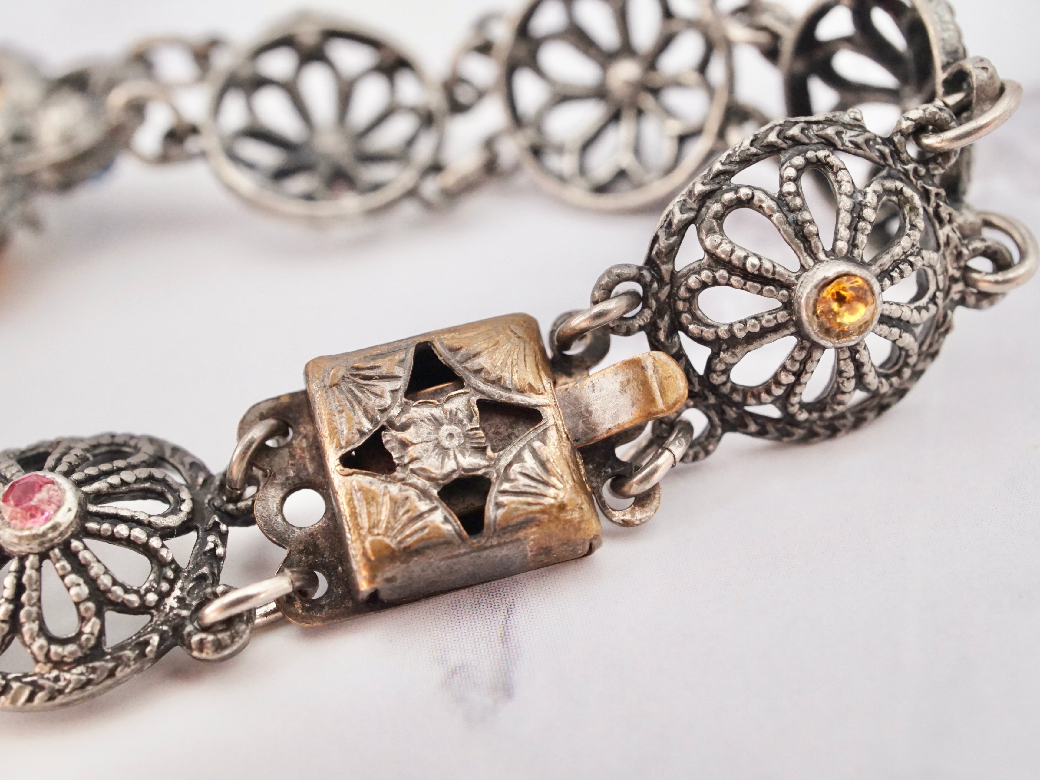 Antique harlequin Czech glass and metal filigree bracelet