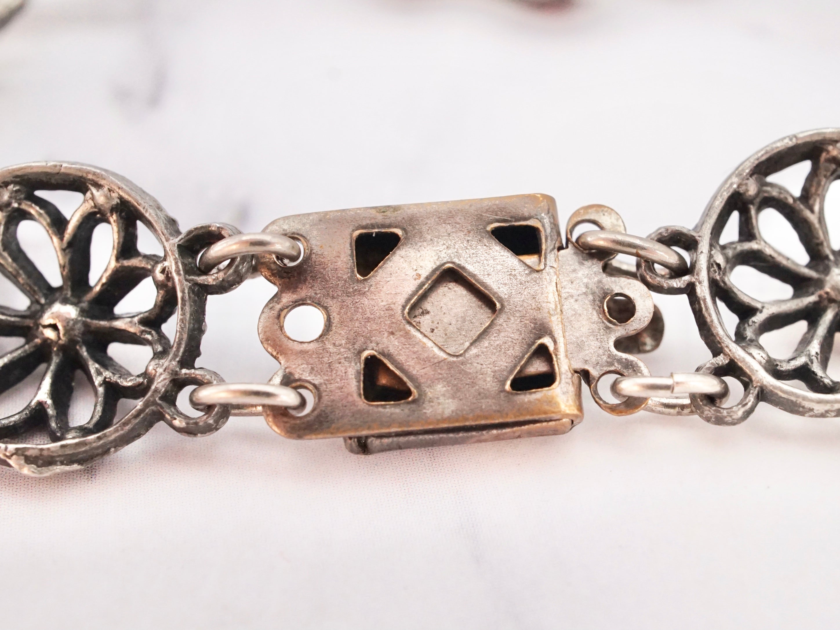 Antique harlequin Czech glass and metal filigree bracelet