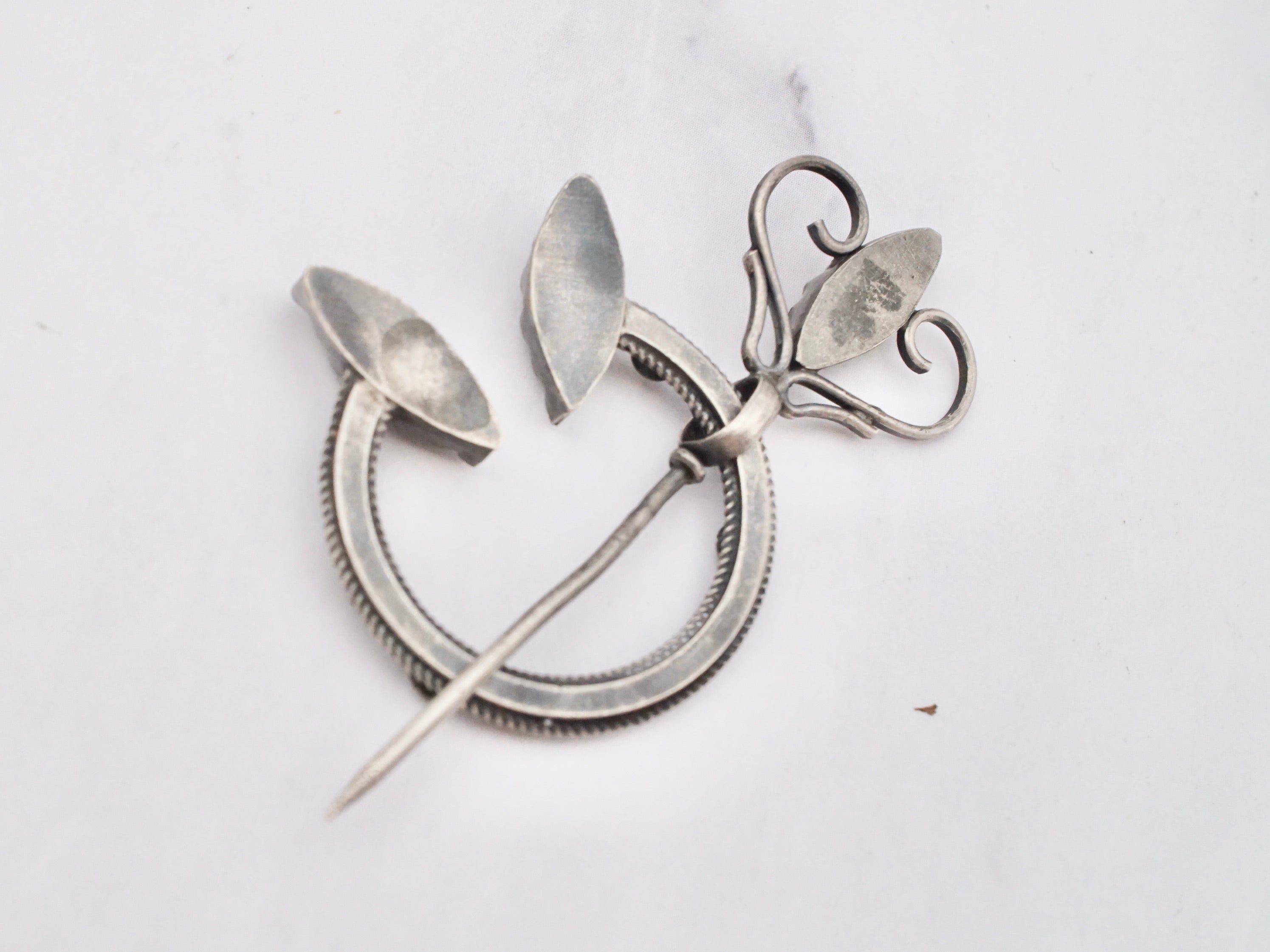 Antique Celtic silver, glass gem, and enamel penannular brooch/cloak pin