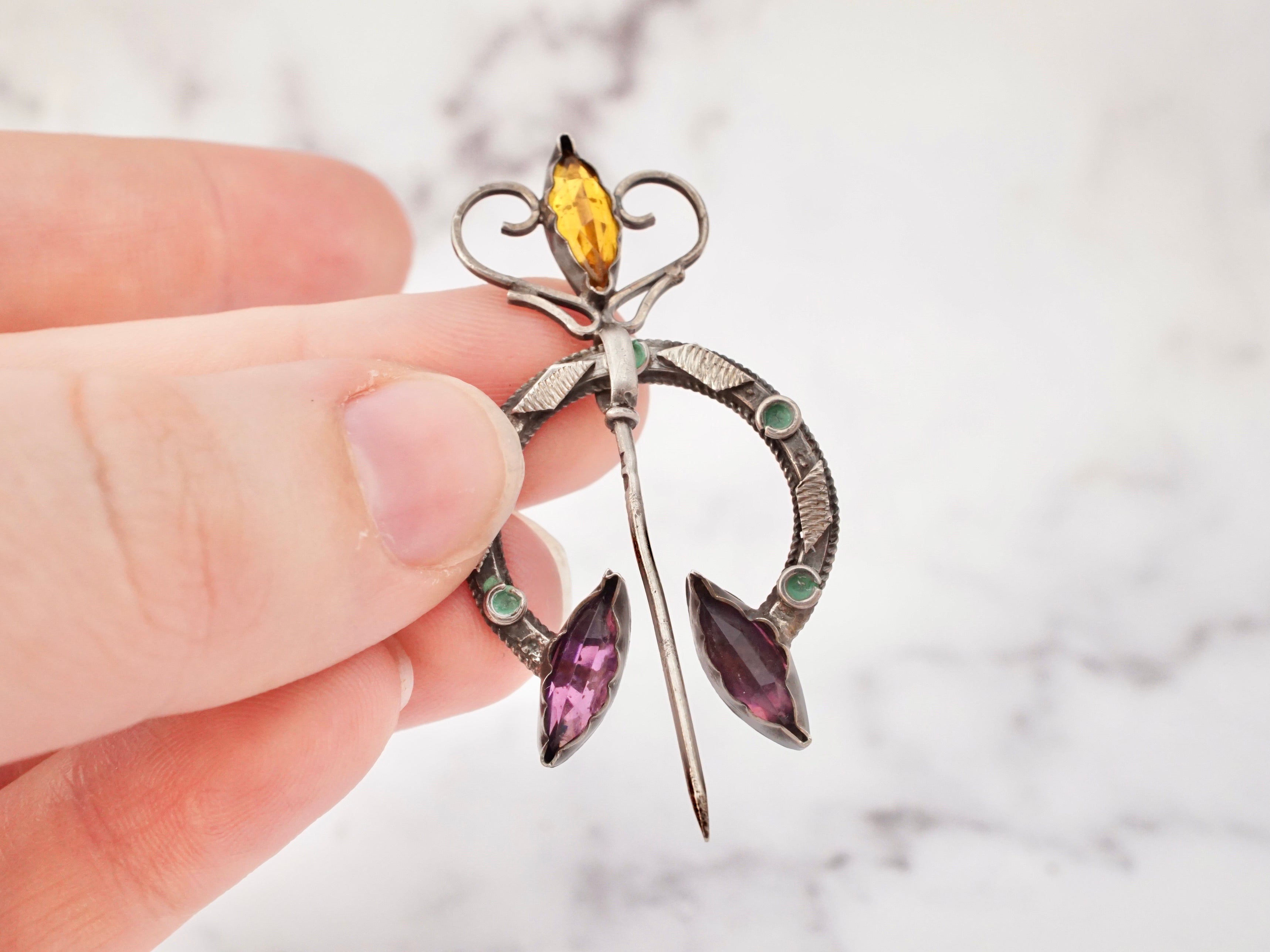 Antique Celtic silver, glass gem, and enamel penannular brooch/cloak pin