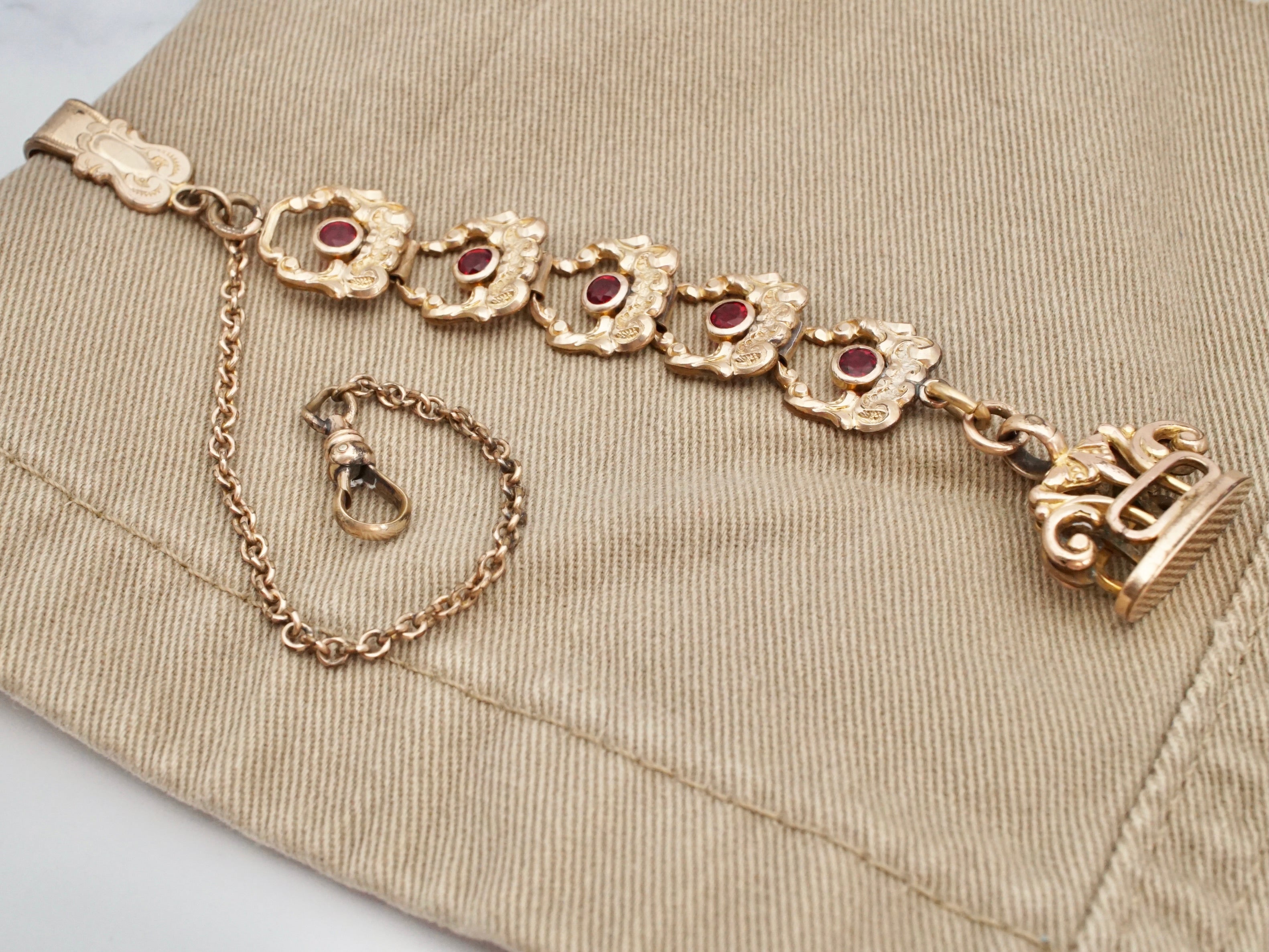 Antique Victorian gold filled long drop watch fob and chain with ruby paste and dog clip