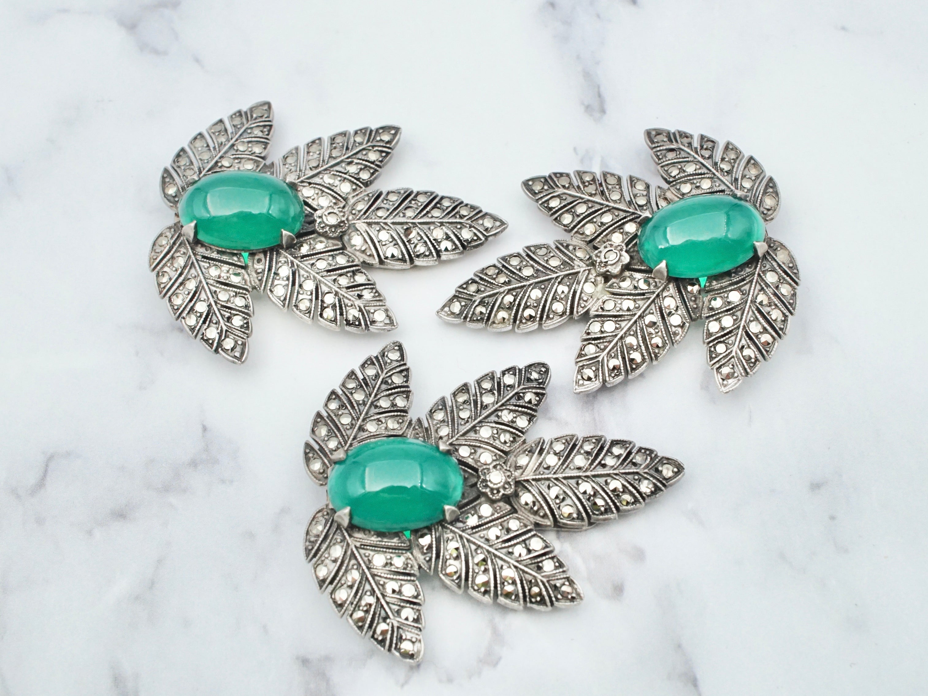 Antique art deco sterling, marcasite, and chrysoprase dress clips