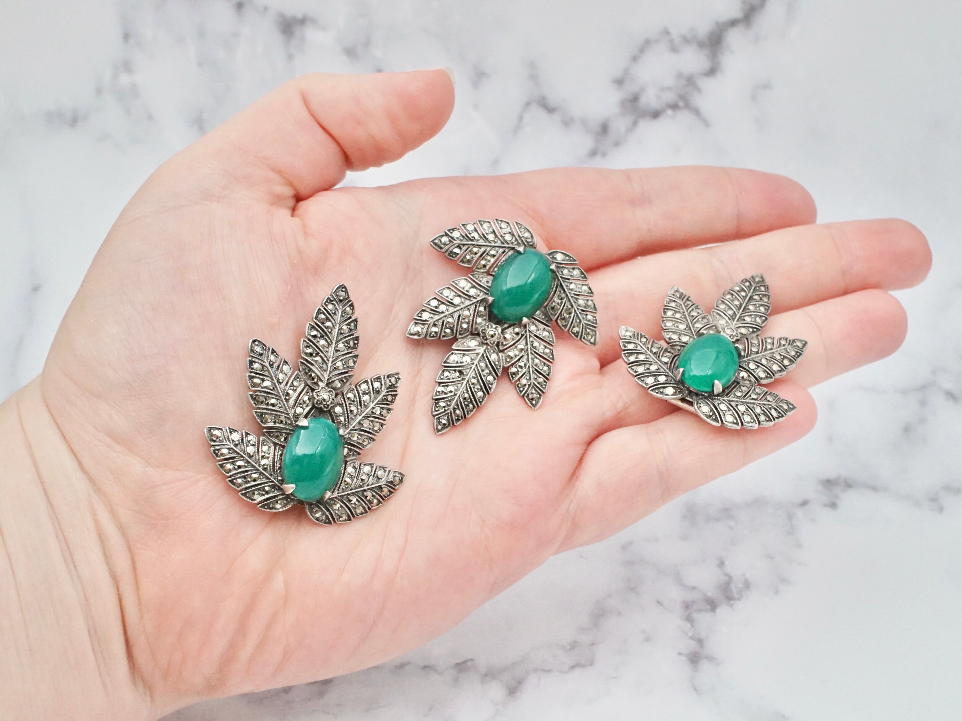 Antique art deco sterling, marcasite, and chrysoprase dress clips