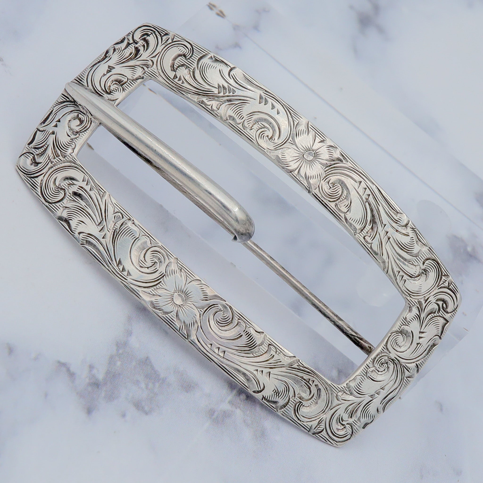 Pair of Antique bright cut engraved sterling Unger Brothers buckle brooches