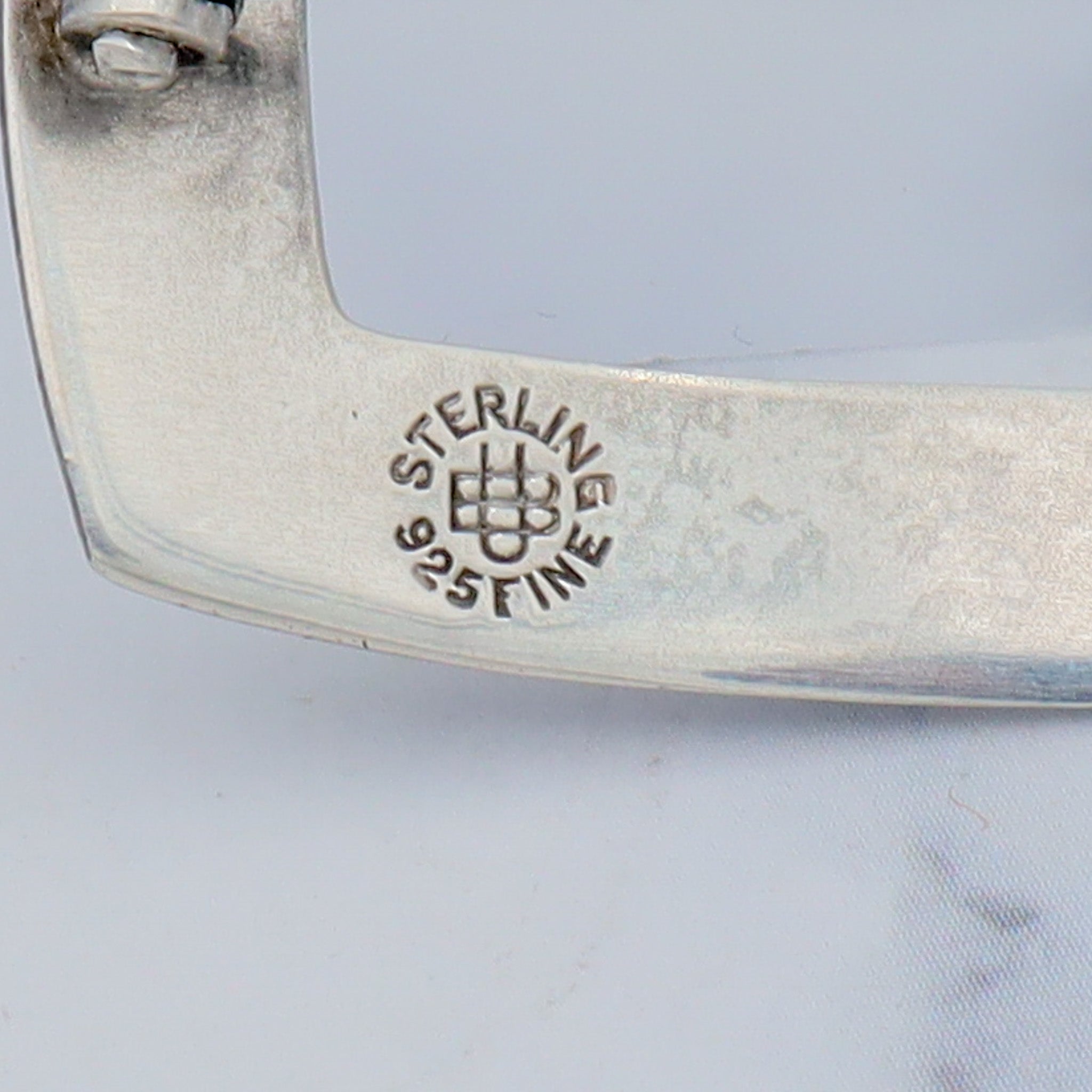 Pair of Antique bright cut engraved sterling Unger Brothers buckle brooches