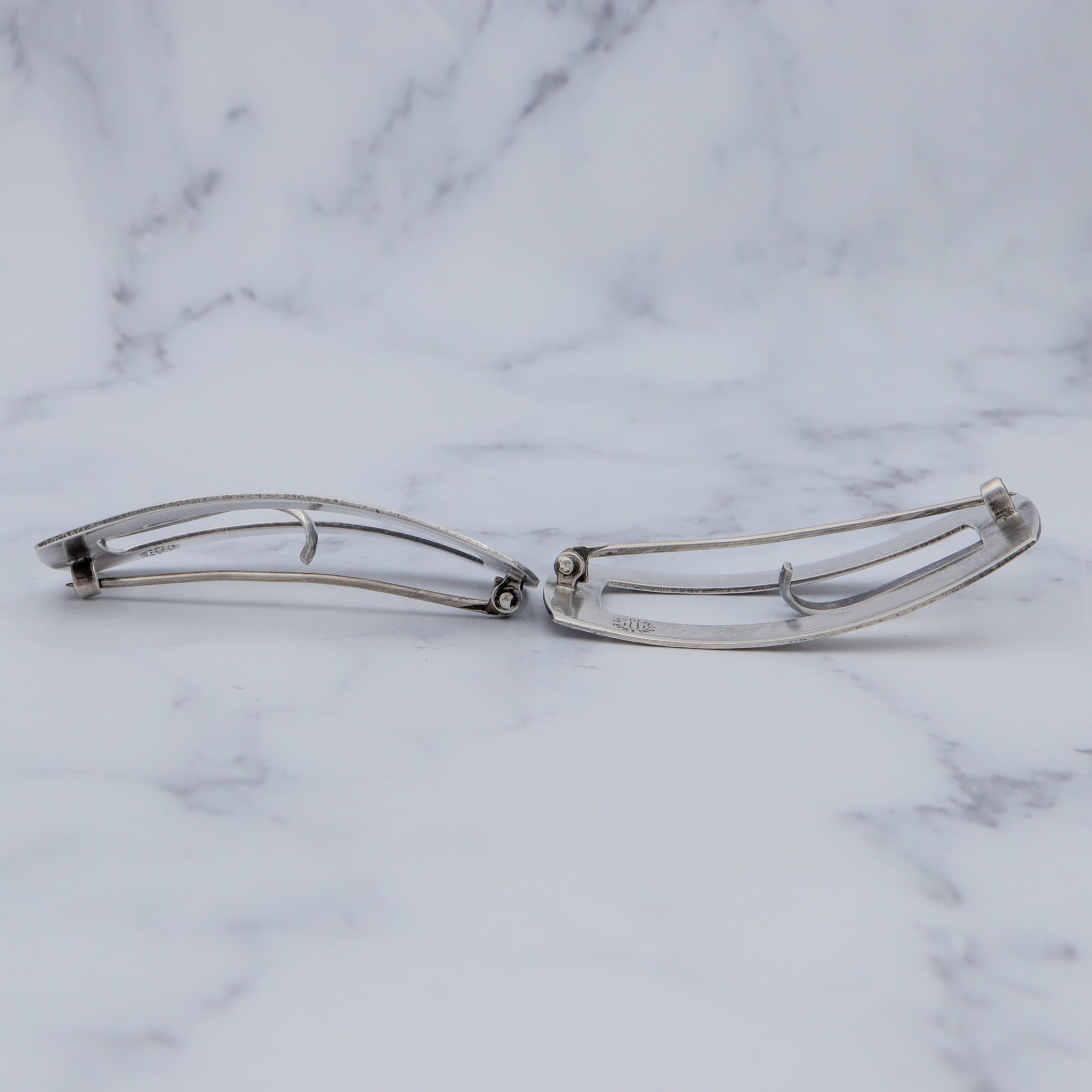 Pair of Antique bright cut engraved sterling Unger Brothers buckle brooches