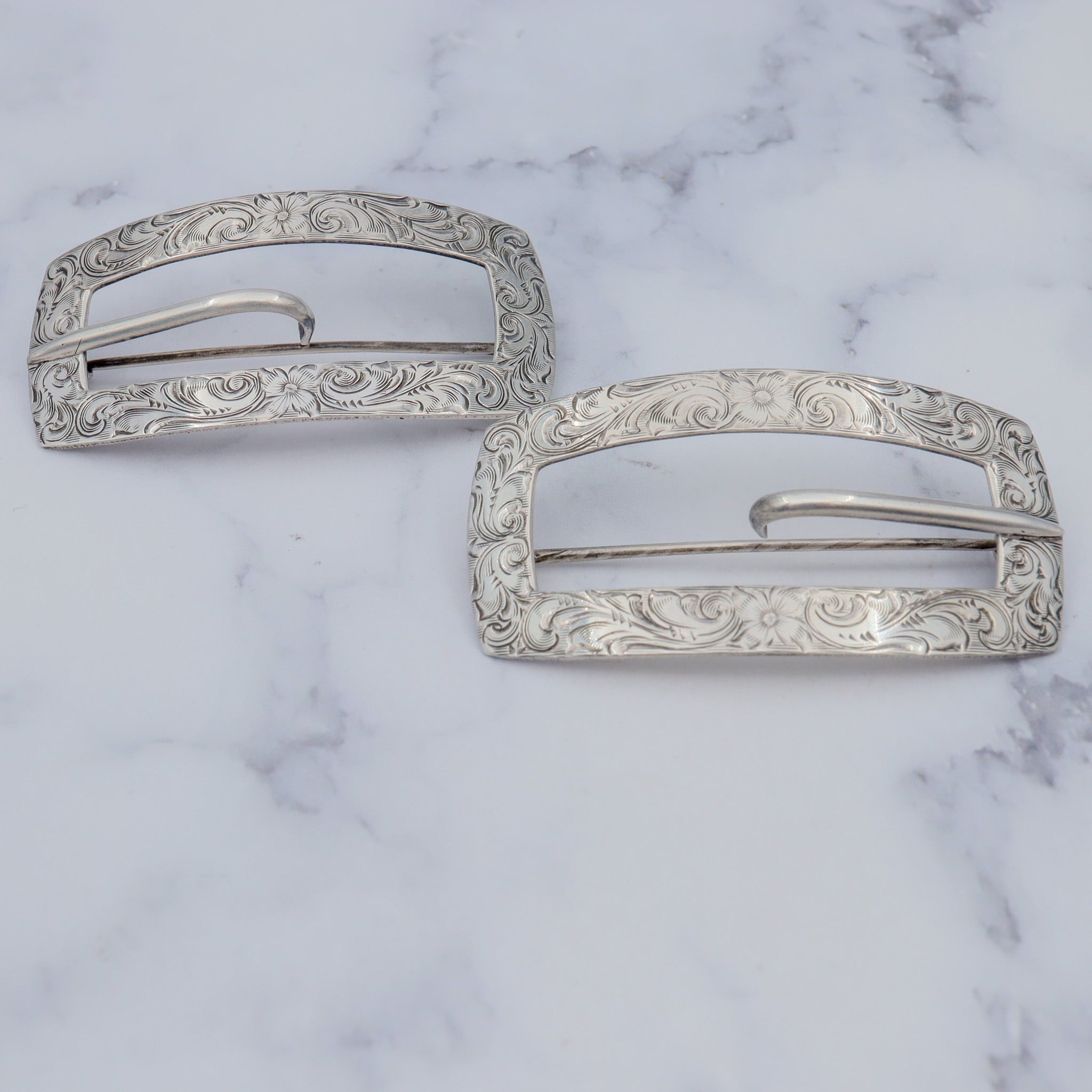 Pair of Antique bright cut engraved sterling Unger Brothers buckle brooches