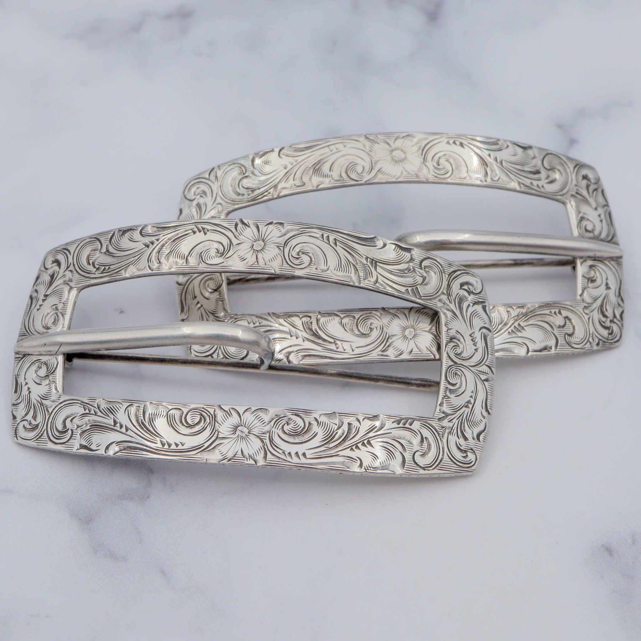 Pair of Antique bright cut engraved sterling Unger Brothers buckle brooches