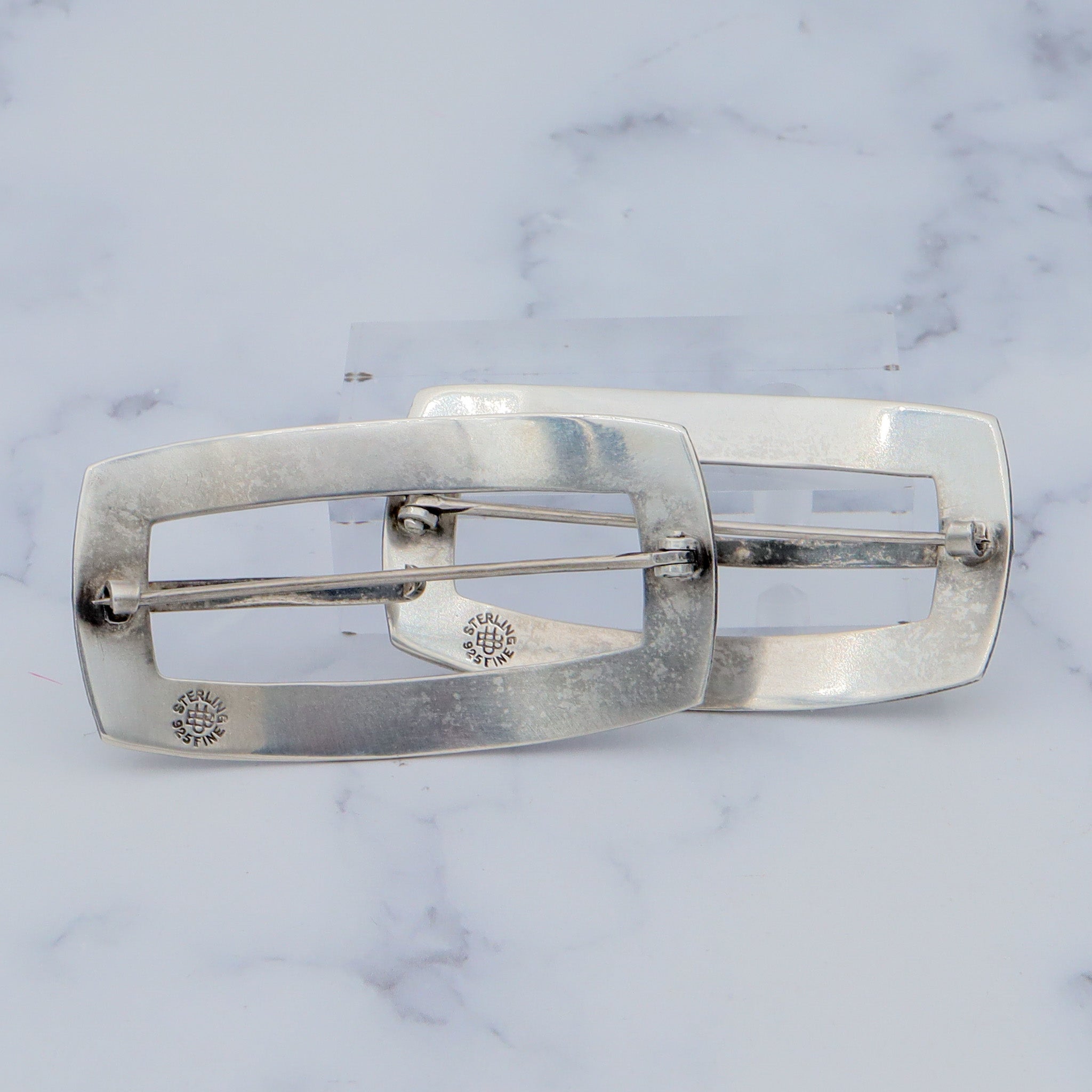 Pair of Antique bright cut engraved sterling Unger Brothers buckle brooches