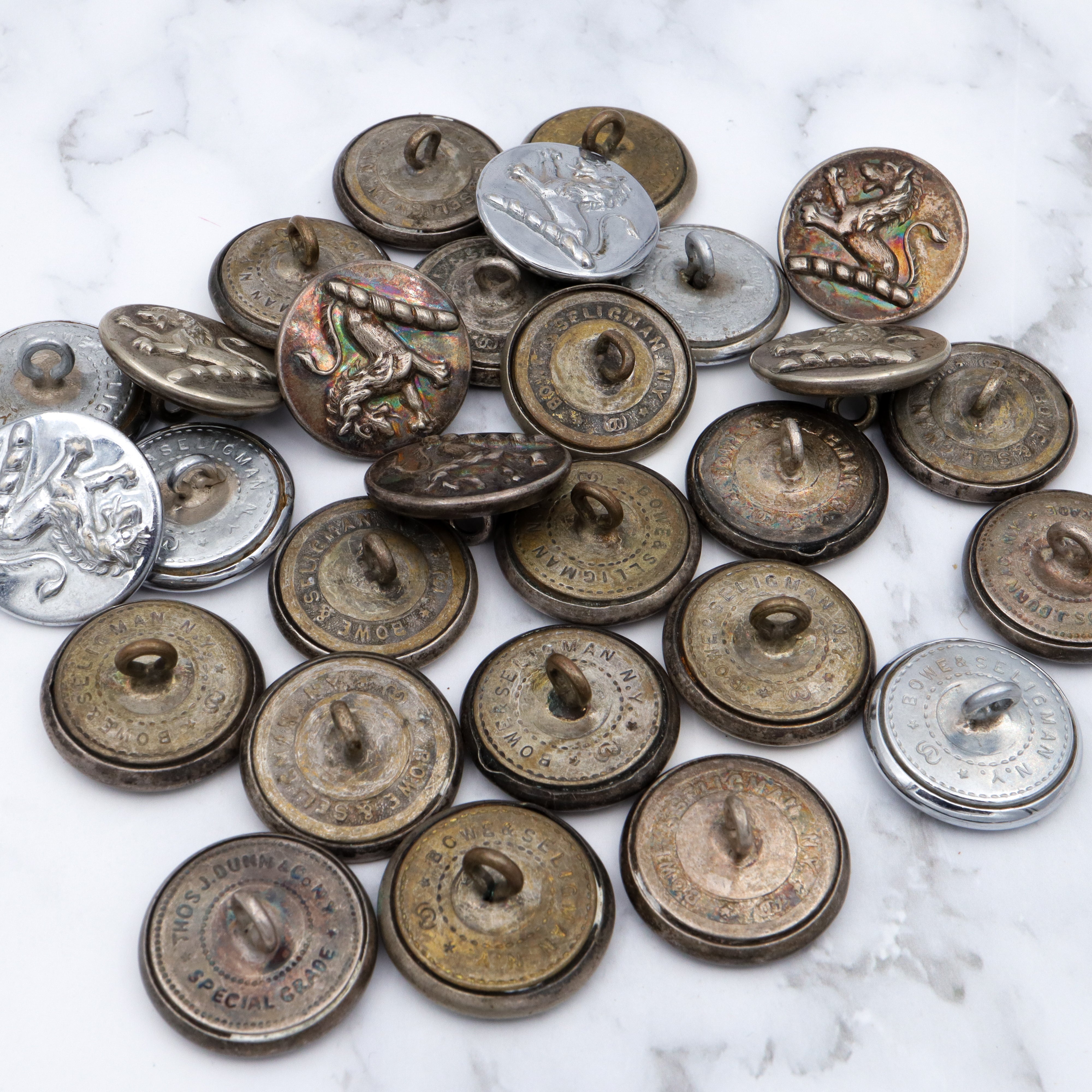 Large group of 28 Antique silver-plated brass livery buttons with rampant lion