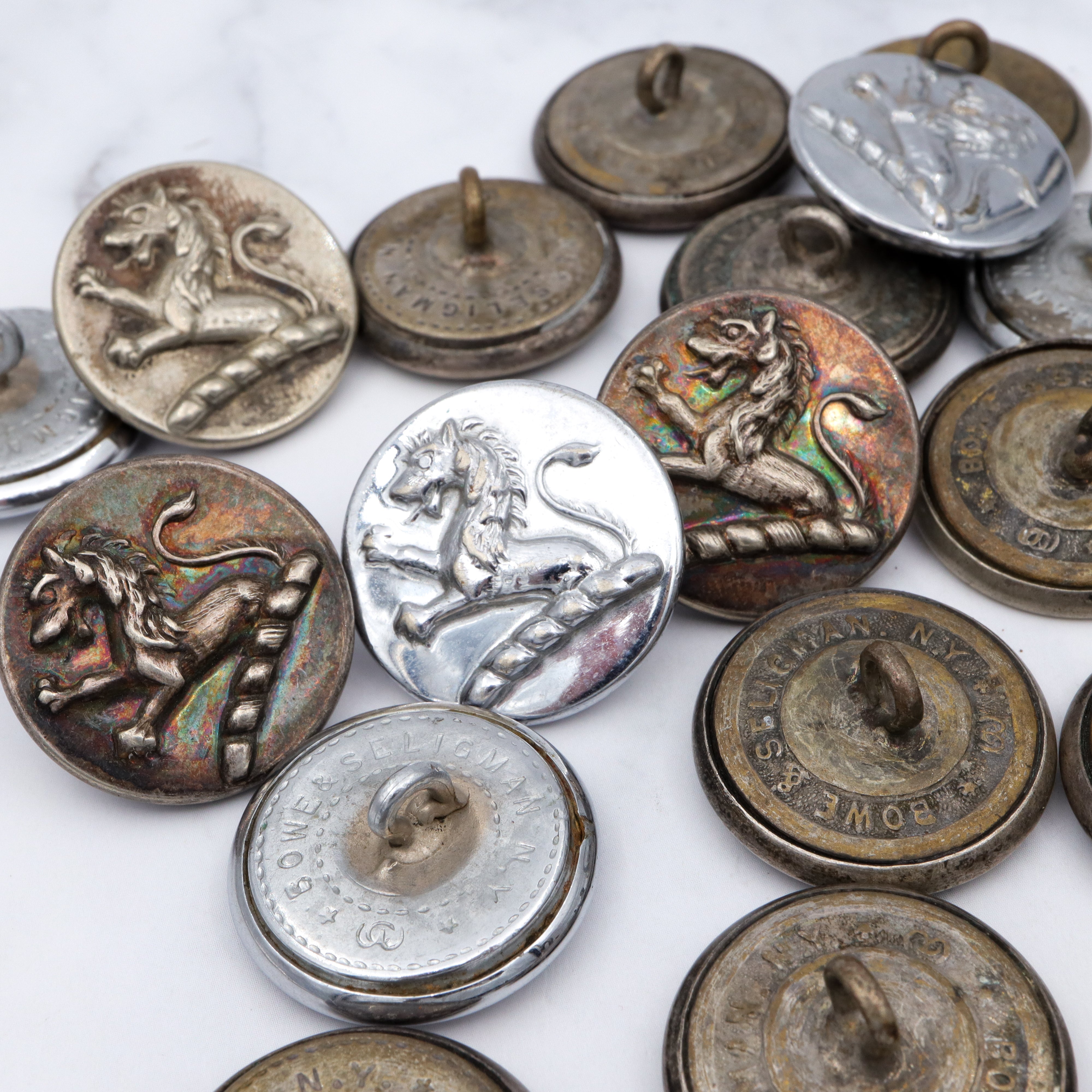 Large group of 28 Antique silver-plated brass livery buttons with rampant lion