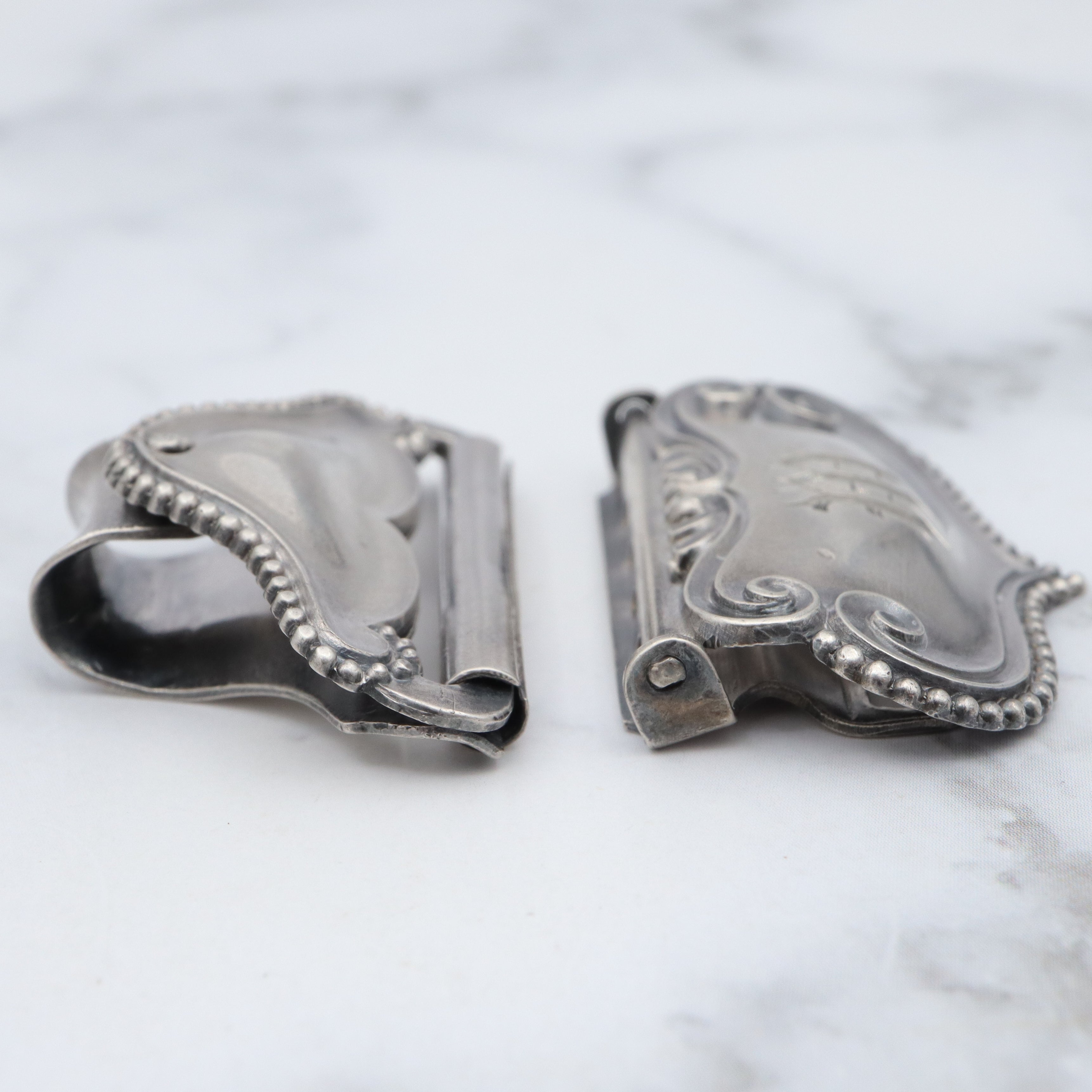 Pair of Antique sterling suspender buckle clips by Sloan & Co.