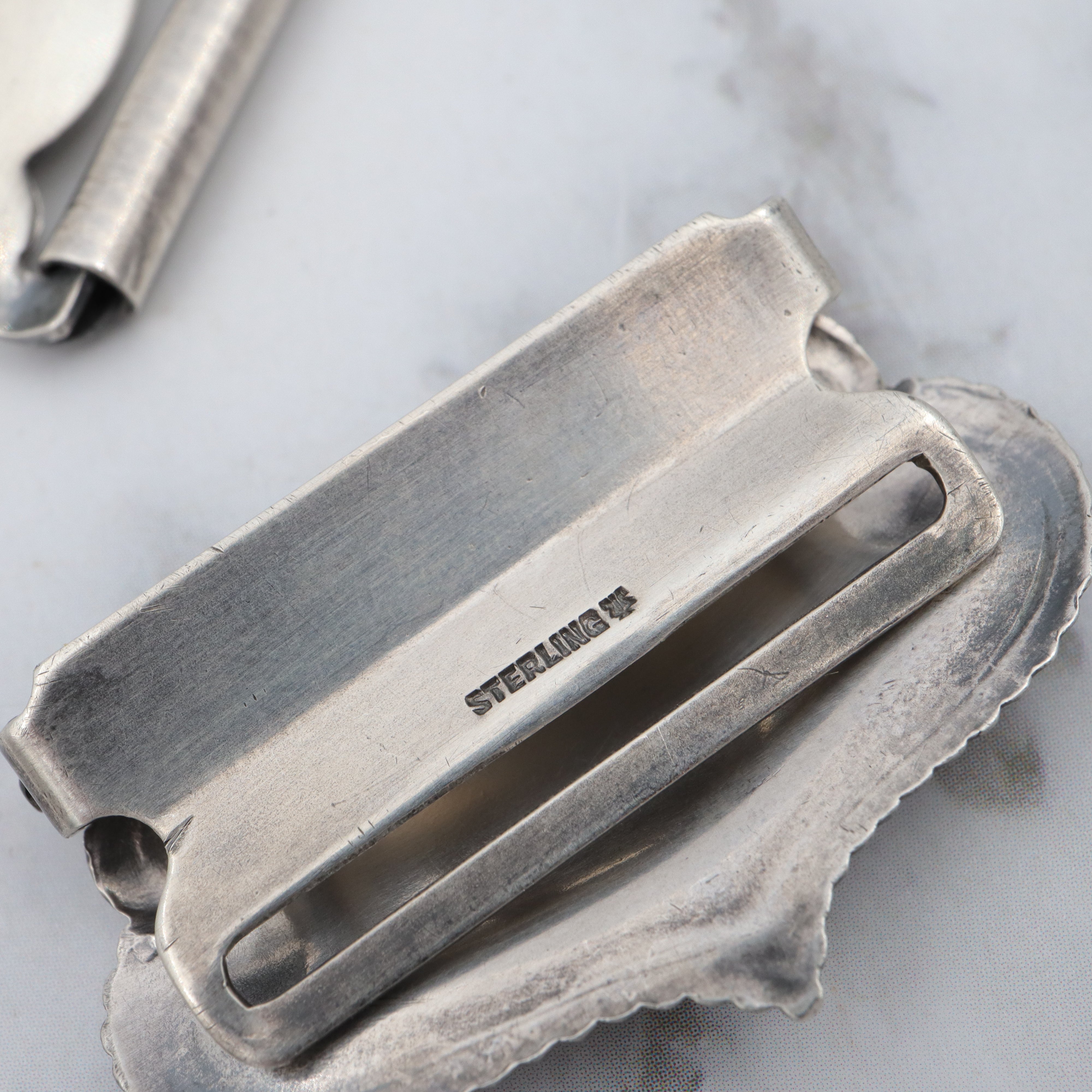 Pair of Antique sterling suspender buckle clips by Sloan & Co.