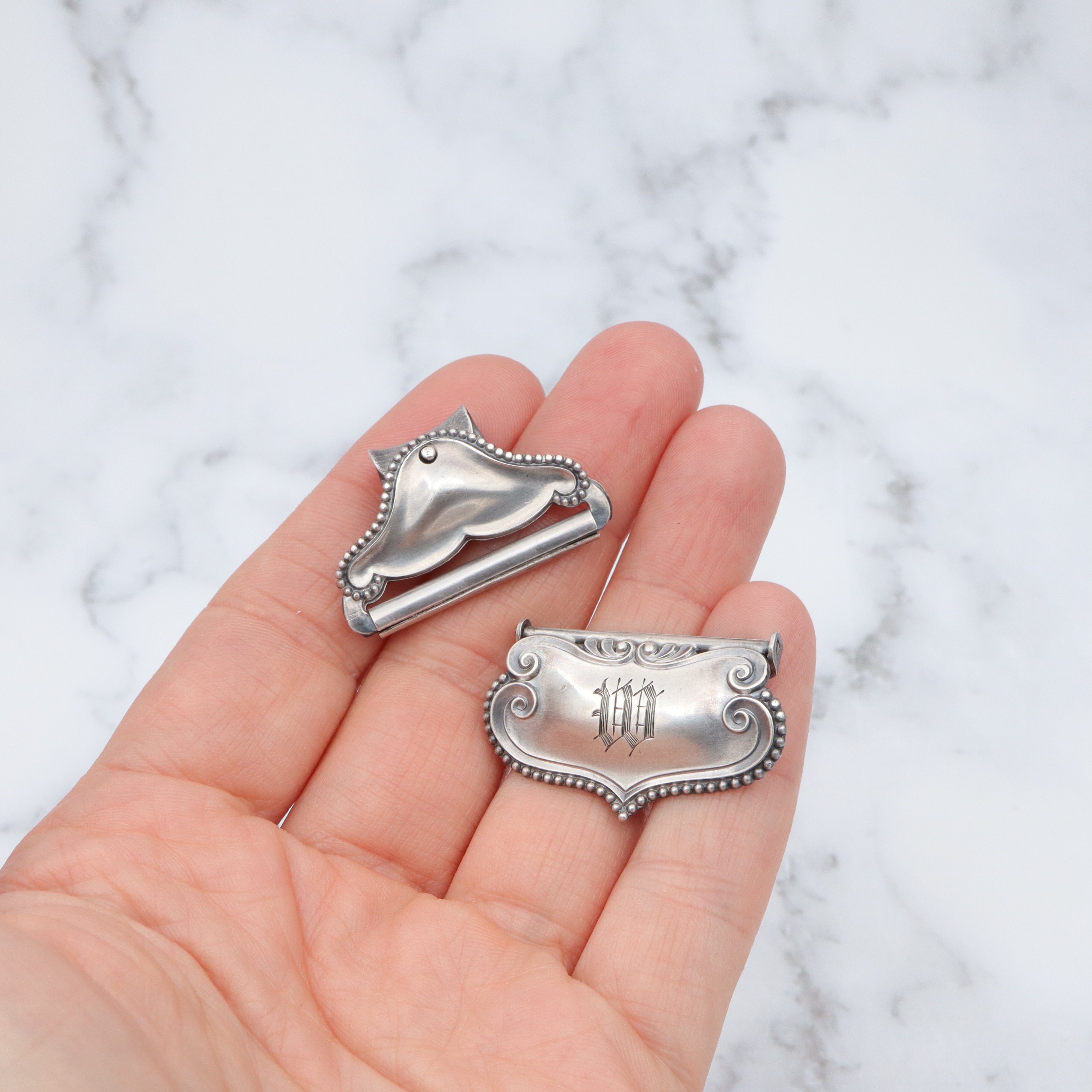 Pair of Antique sterling suspender buckle clips by Sloan & Co.
