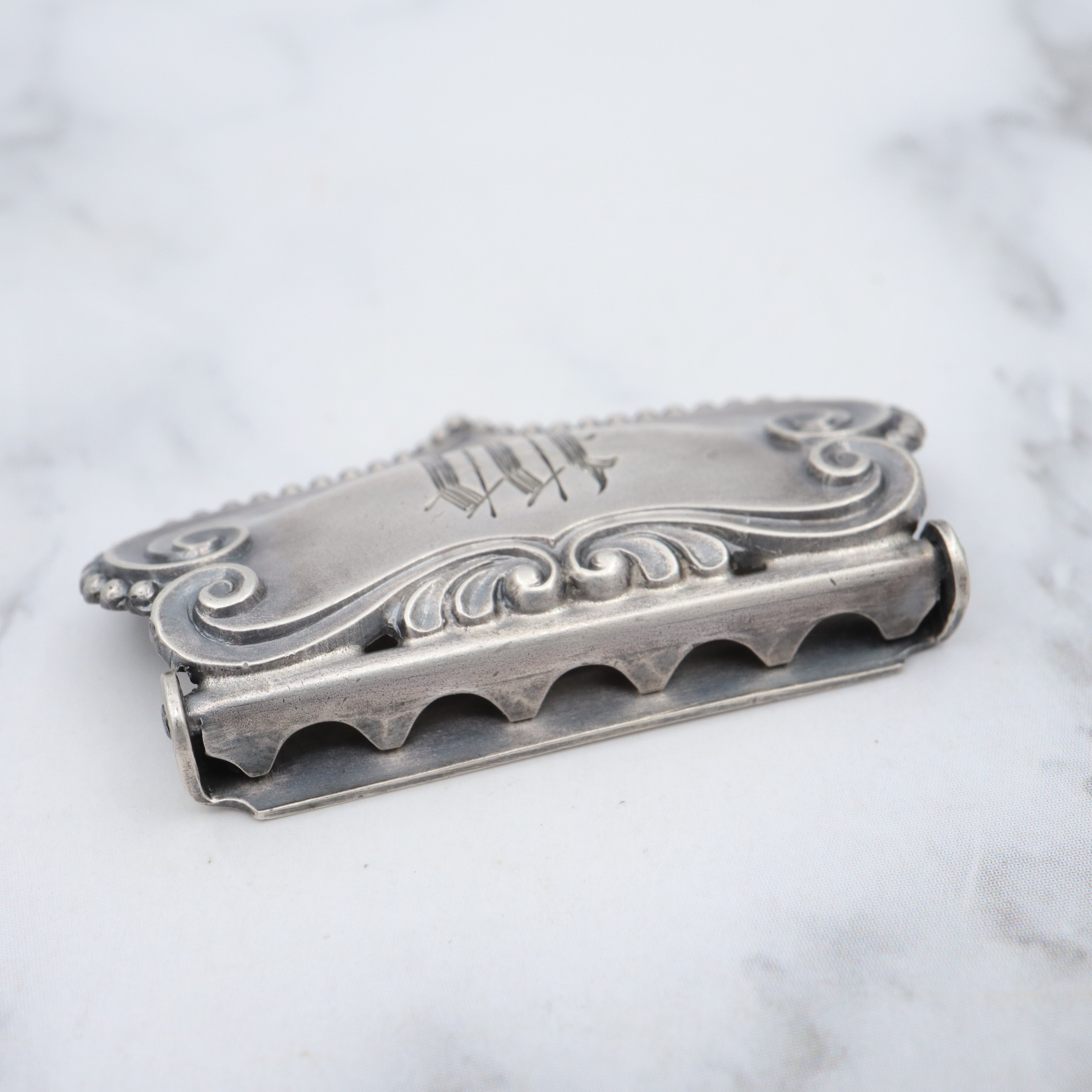 Pair of Antique sterling suspender buckle clips by Sloan & Co.