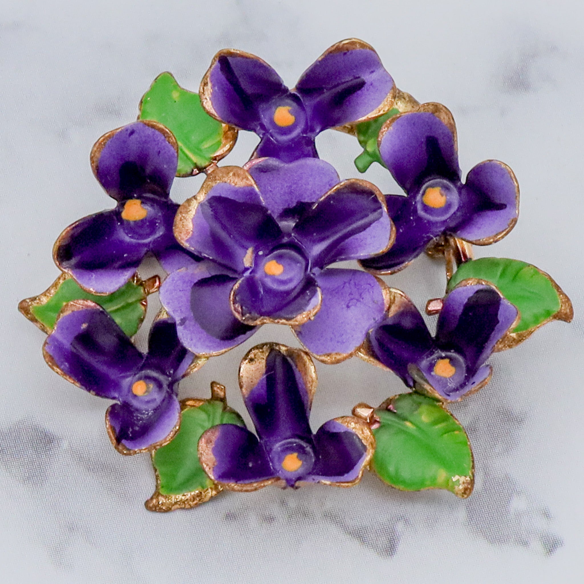Antique painted brass violets brooch