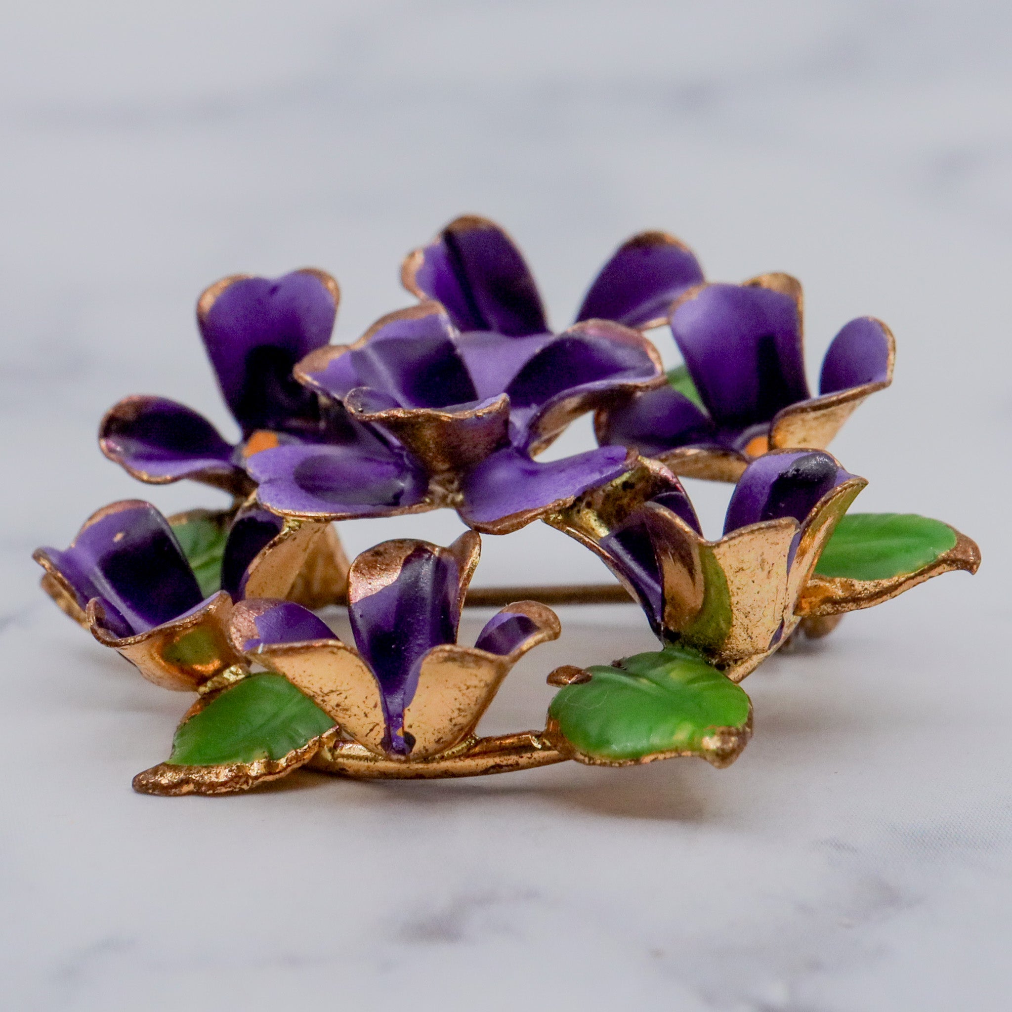 Antique painted brass violets brooch