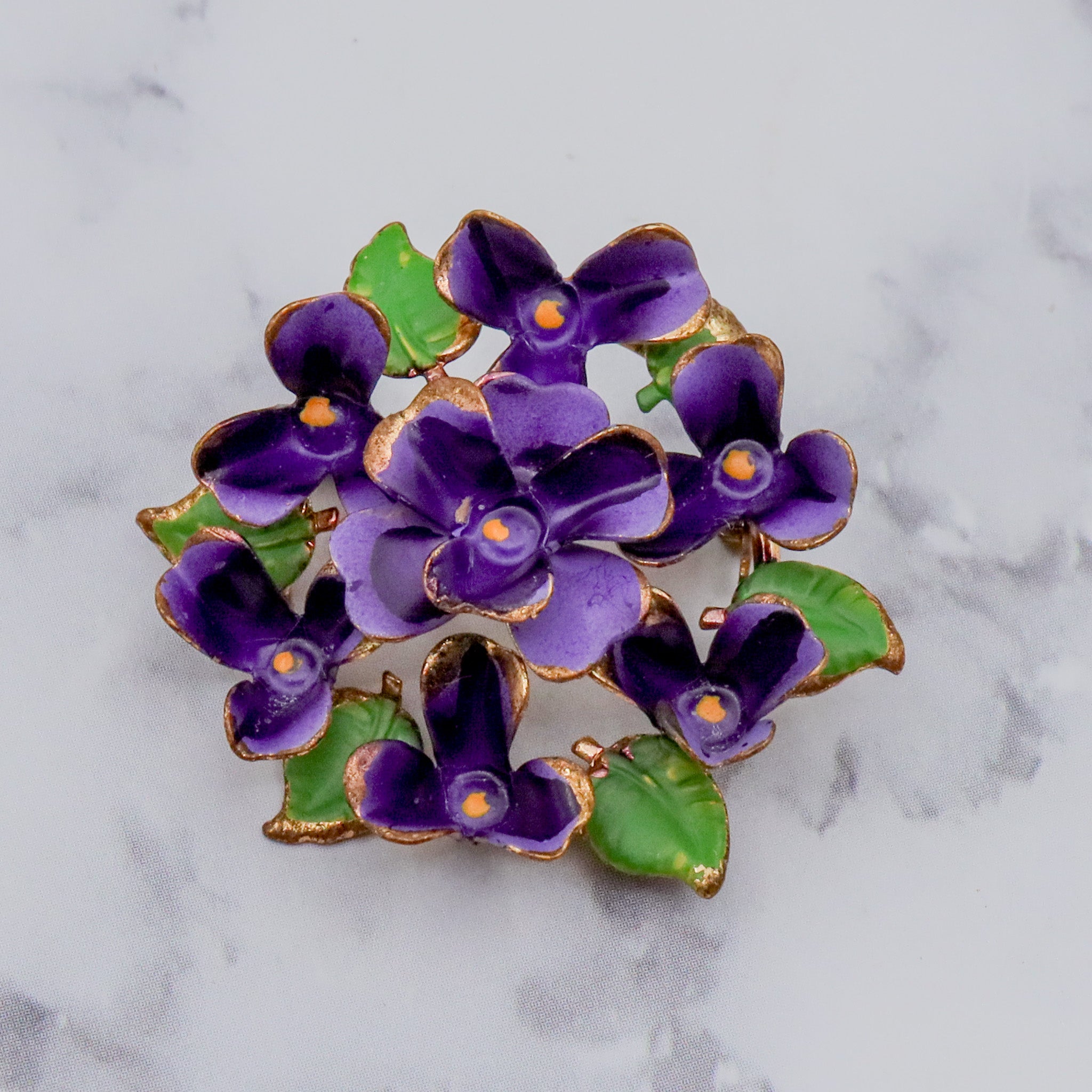 Antique painted brass violets brooch