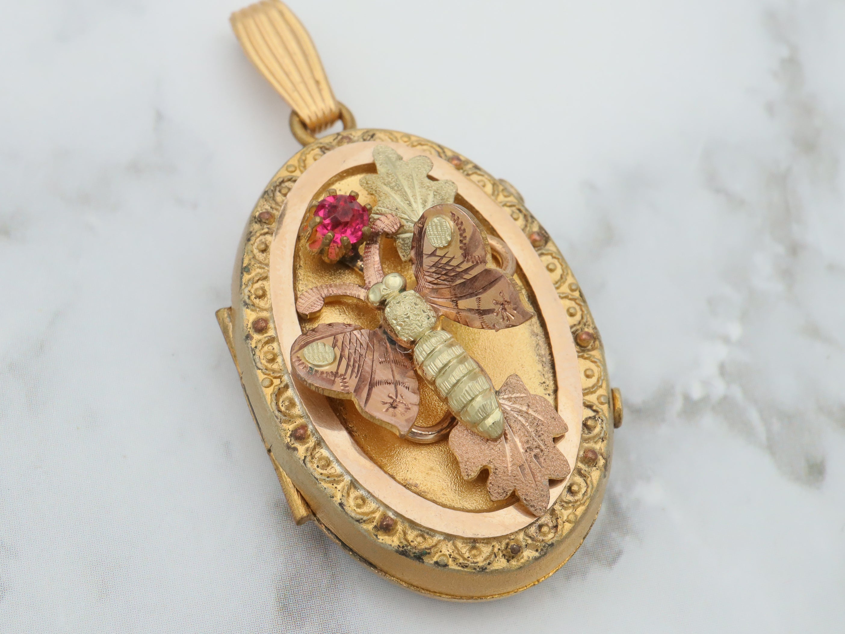 Antique Victorian two tone gold filled locket with moving butterfly