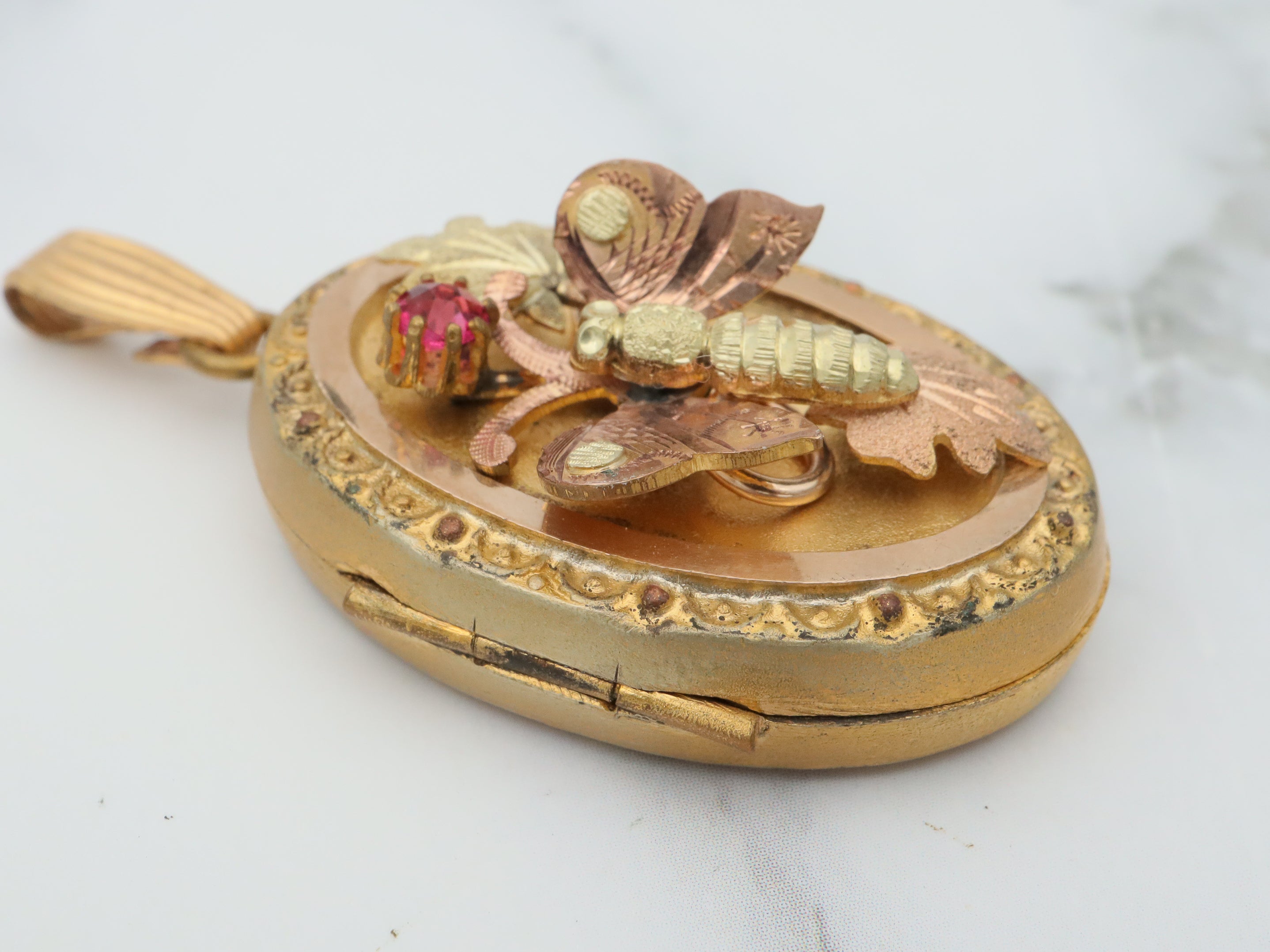 Antique Victorian two tone gold filled locket with moving butterfly