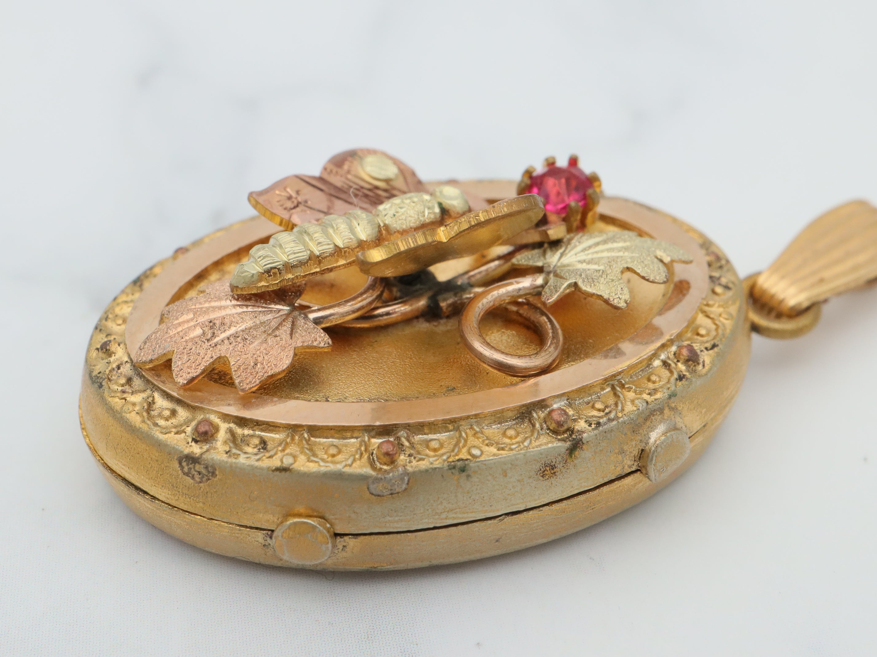 Antique Victorian two tone gold filled locket with moving butterfly