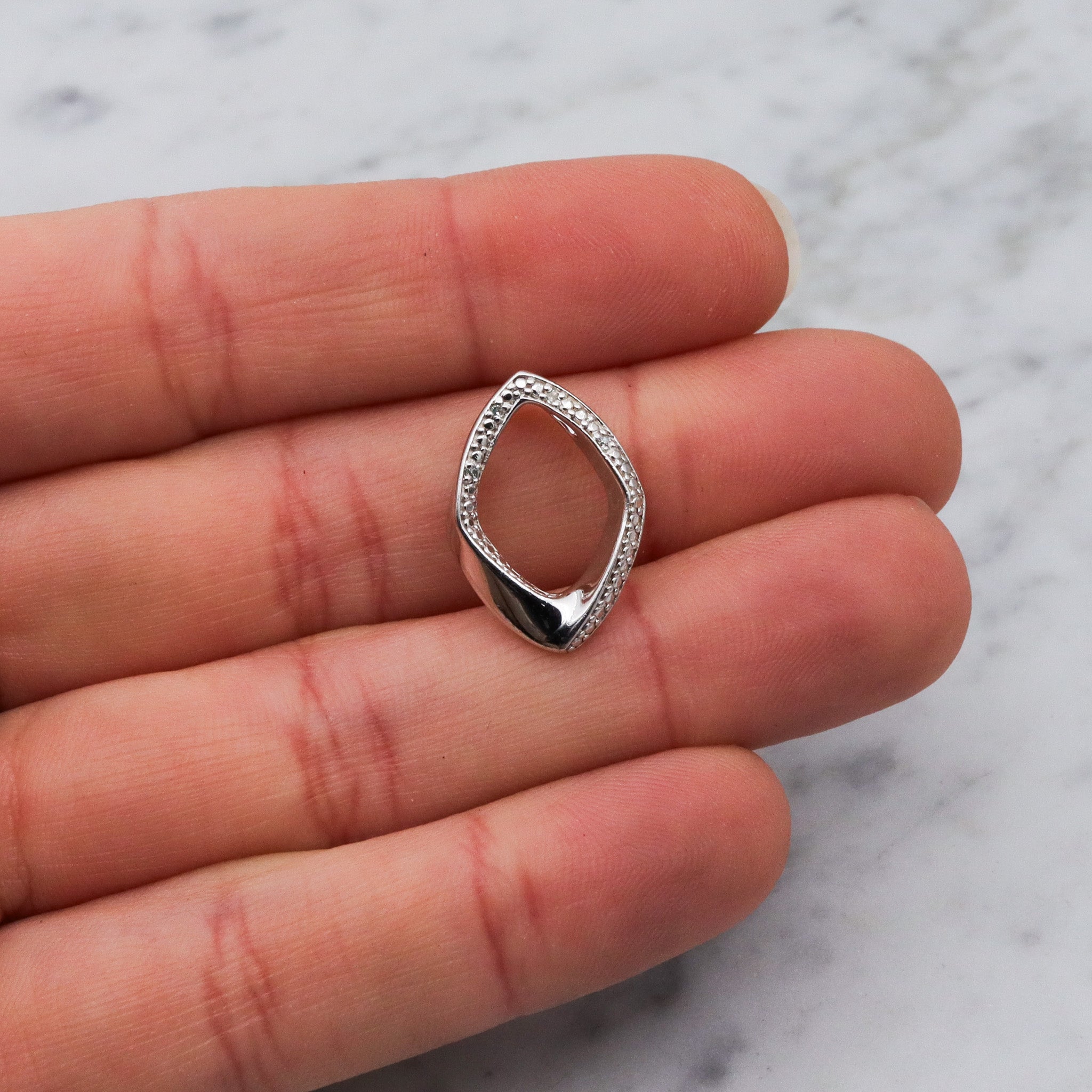 Vintage sterling silver and diamond abstract pendant