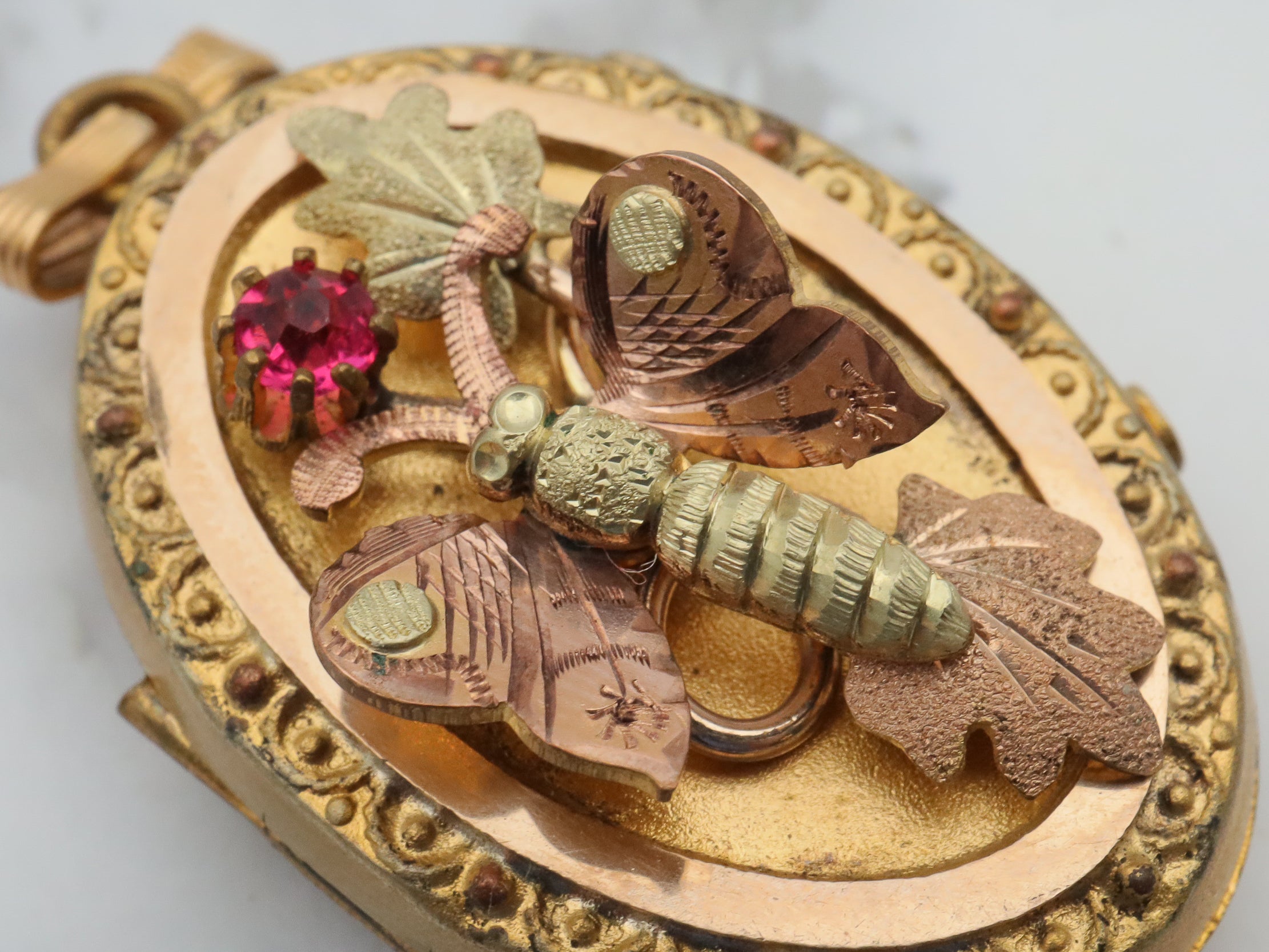 Antique Victorian two tone gold filled locket with moving butterfly