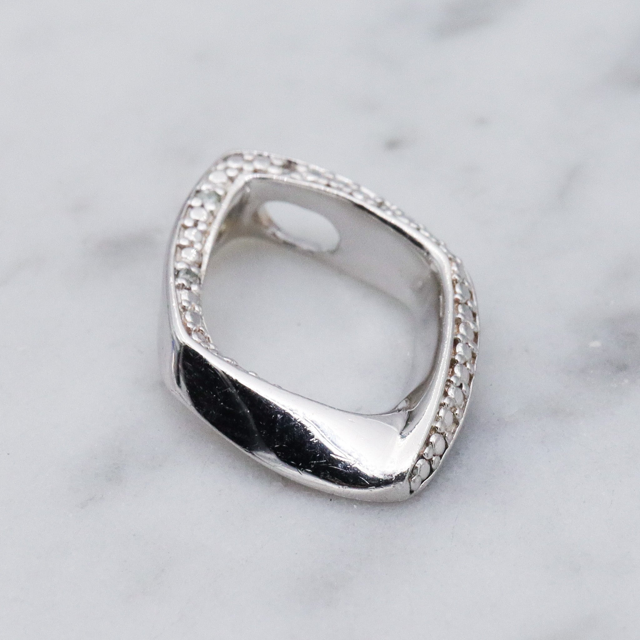 Vintage sterling silver and diamond abstract pendant