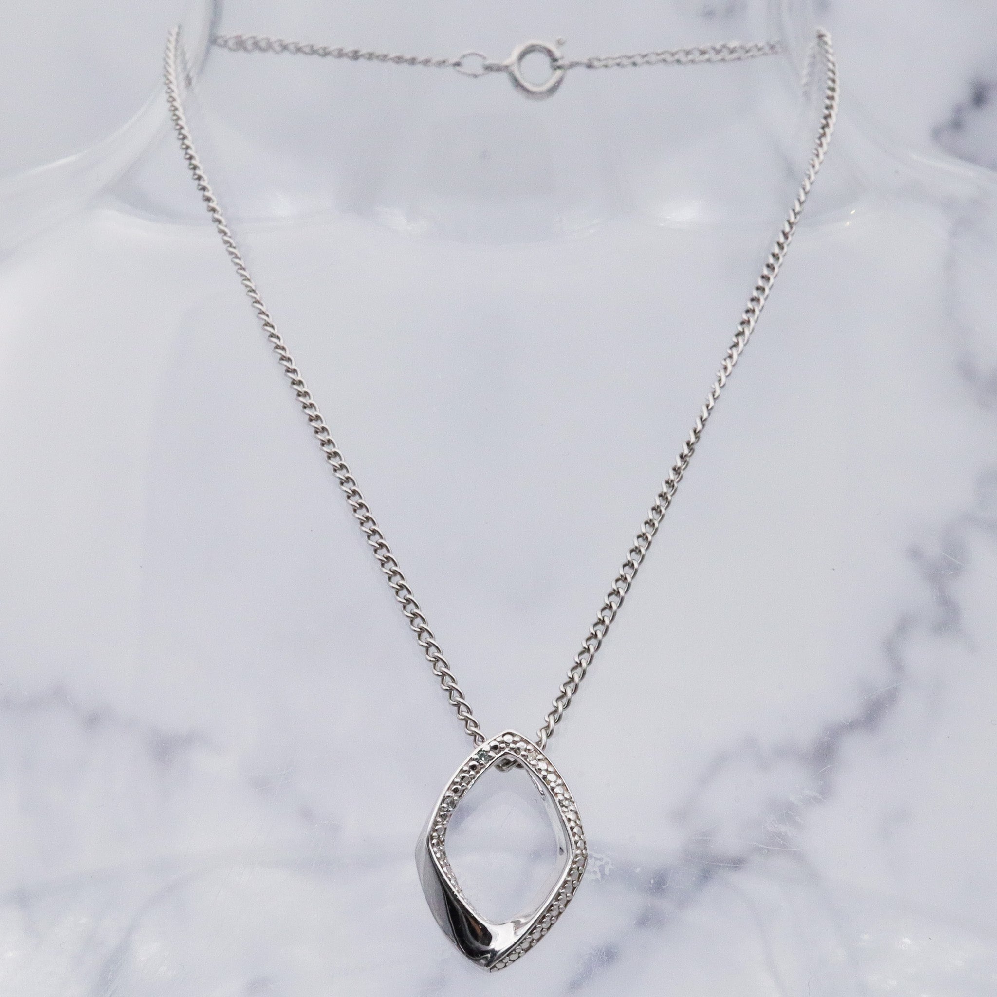 Vintage sterling silver and diamond abstract pendant