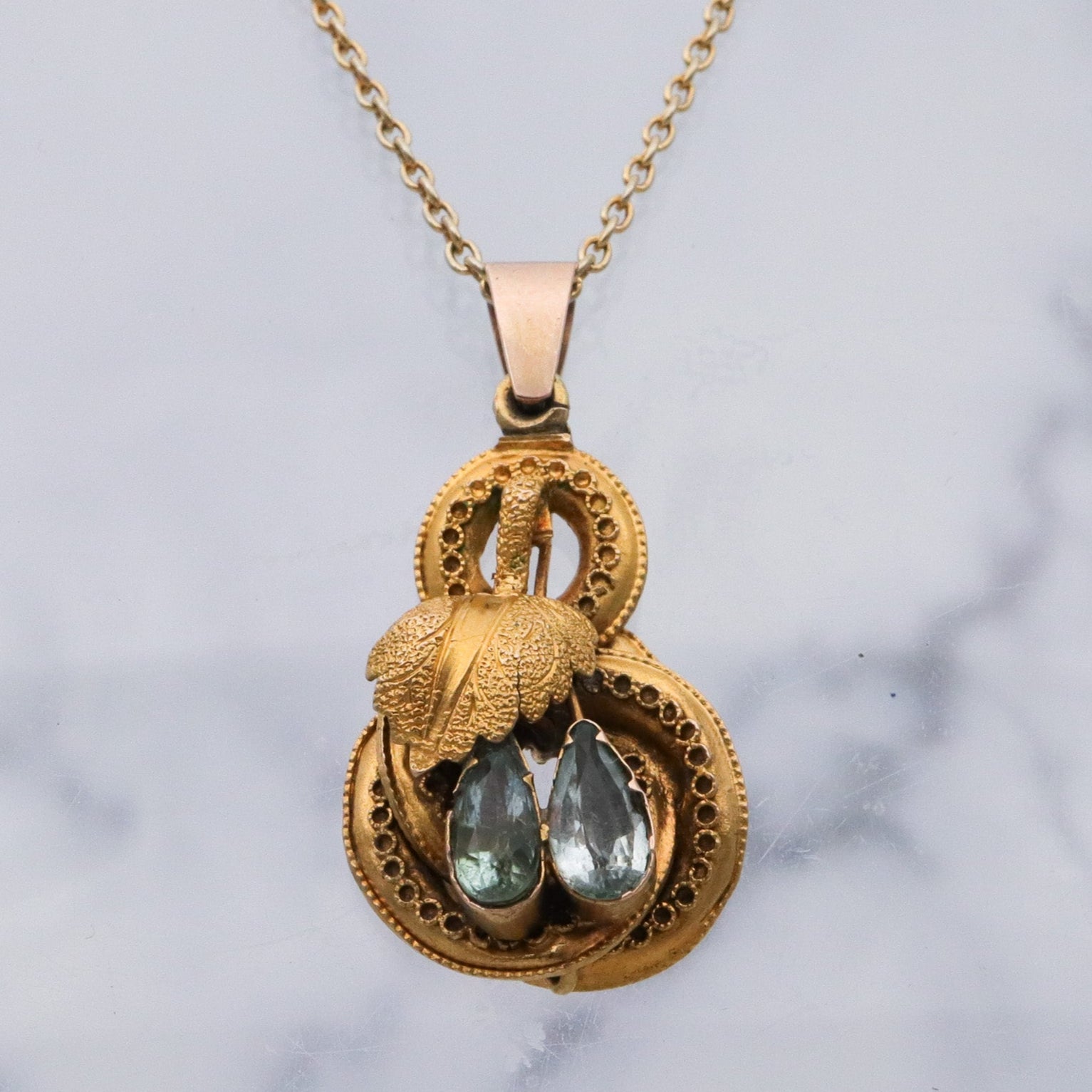 Antique early Victorian 10k gold & natural aquamarine knot pendant