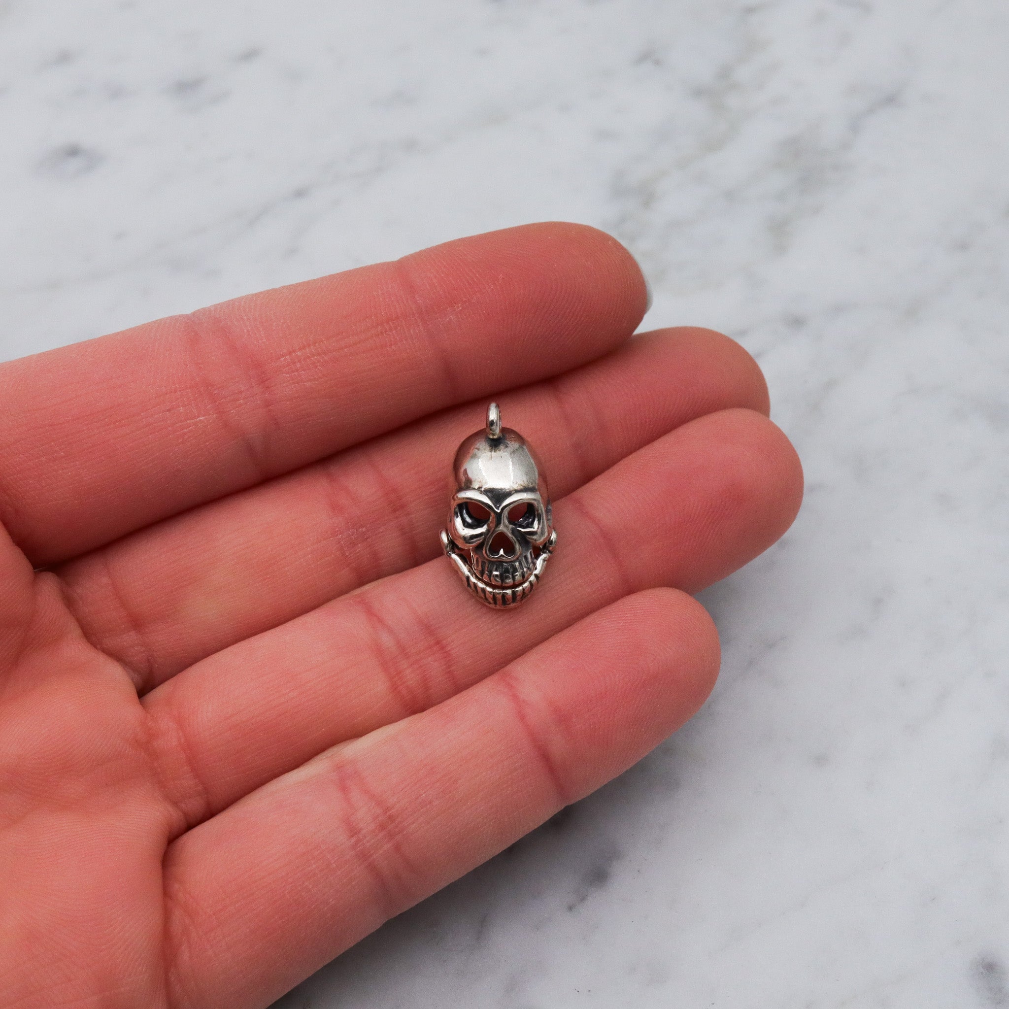 Vintage sterling silver hinged jaw skull pendants