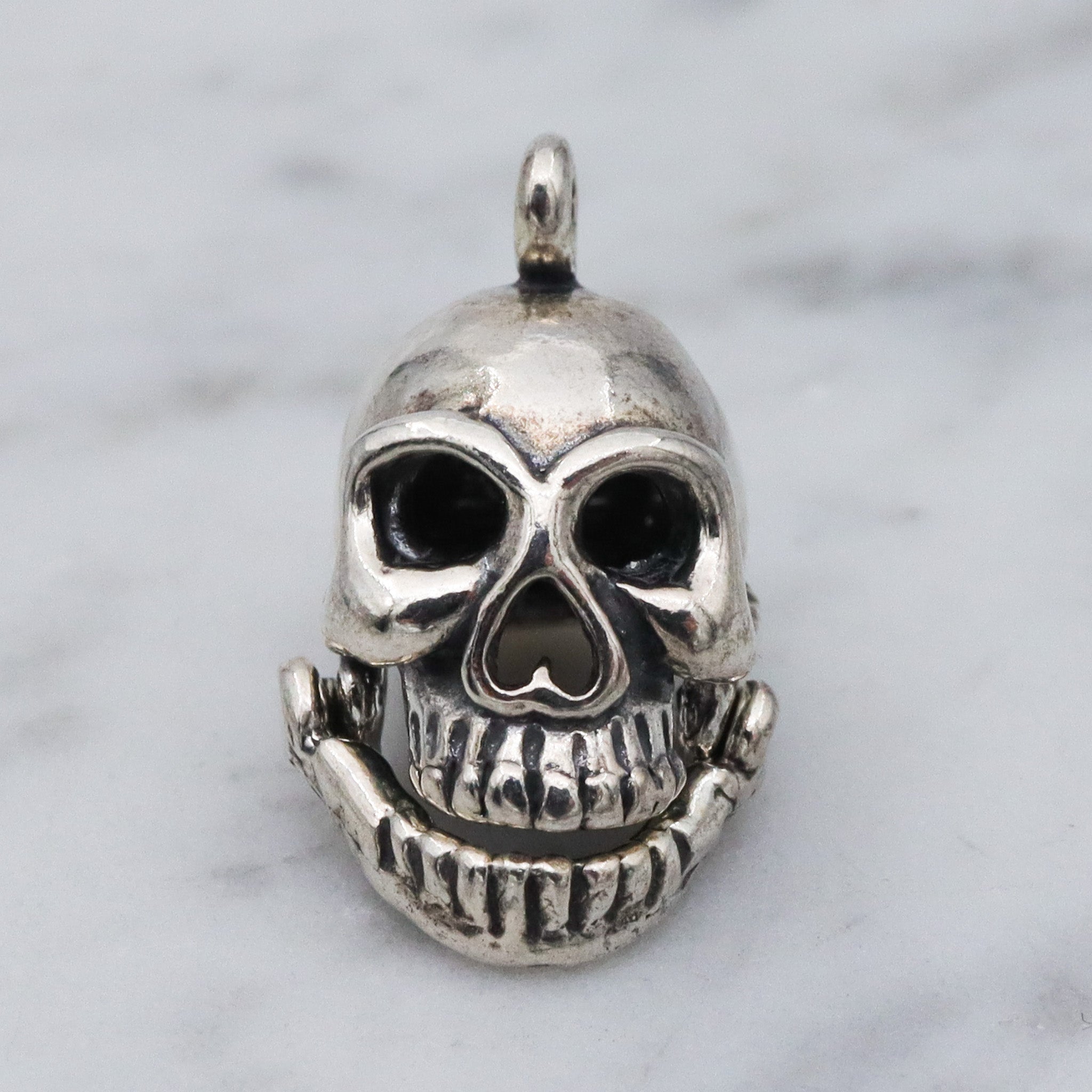 Vintage sterling silver hinged jaw skull pendants