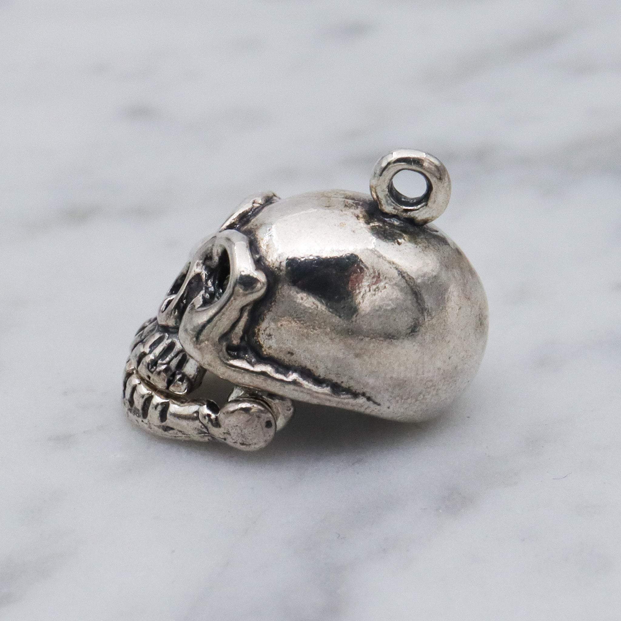 Vintage sterling silver hinged jaw skull pendants