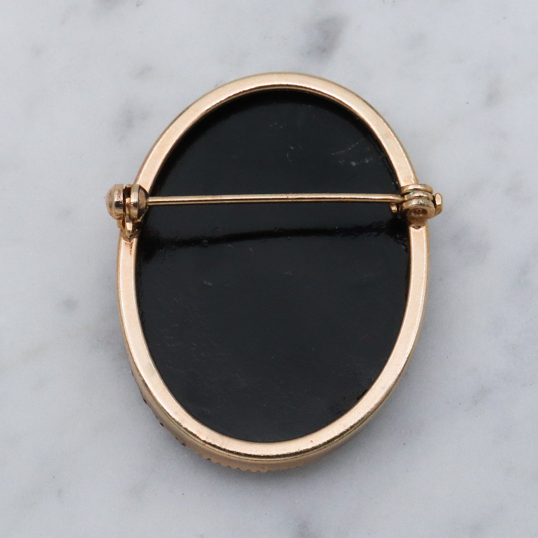 Victorian button style black glass brooch with gold sunburst