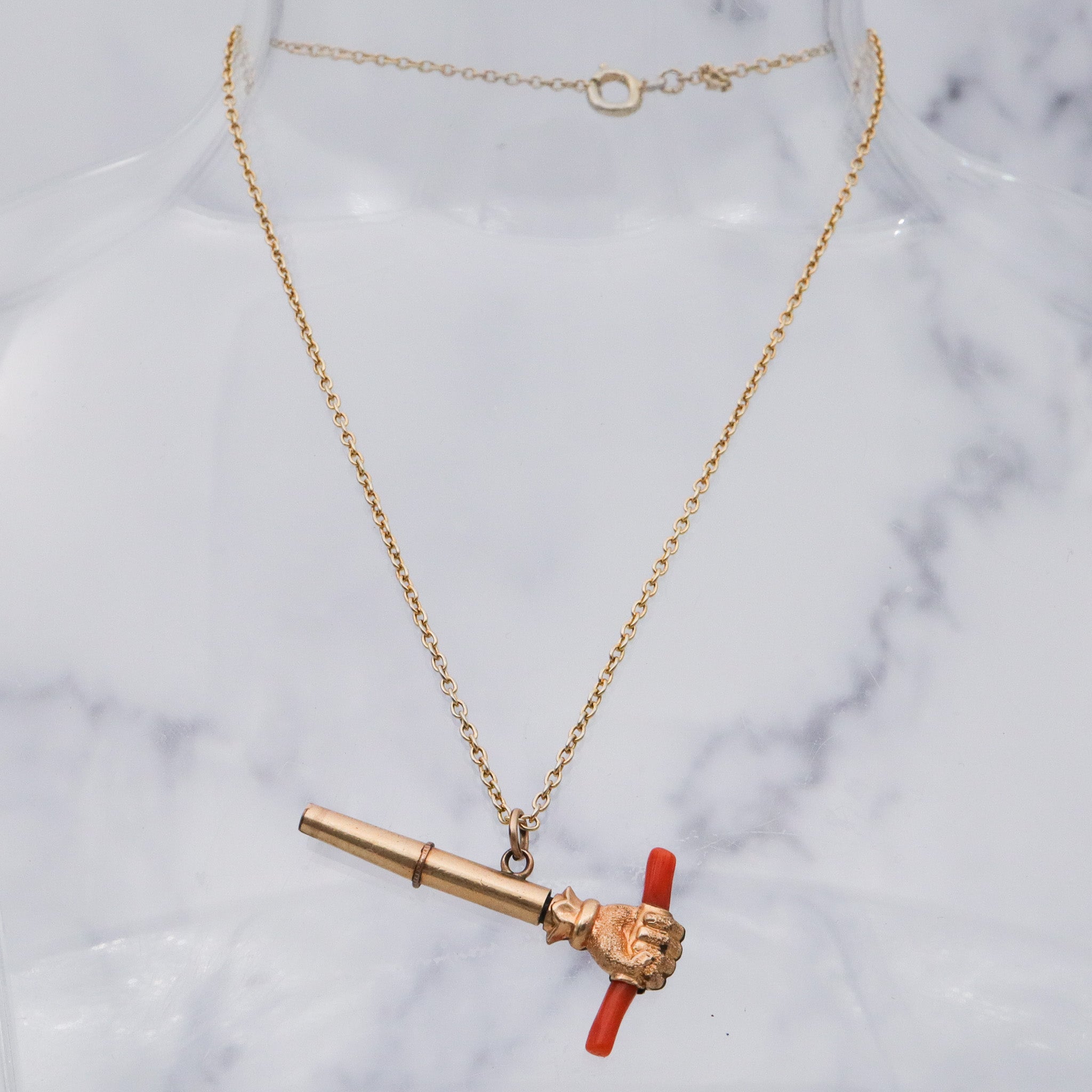 Antique Victorian gold filled raised fist with coral watch key fob