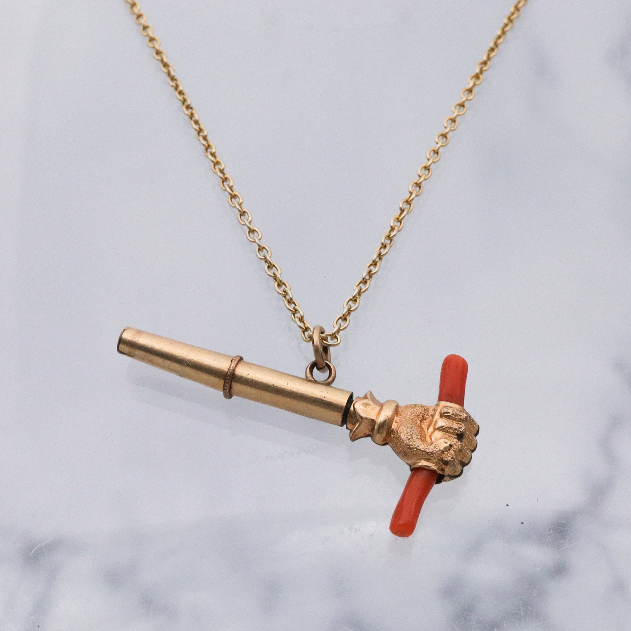 Antique Victorian gold filled raised fist with coral watch key fob