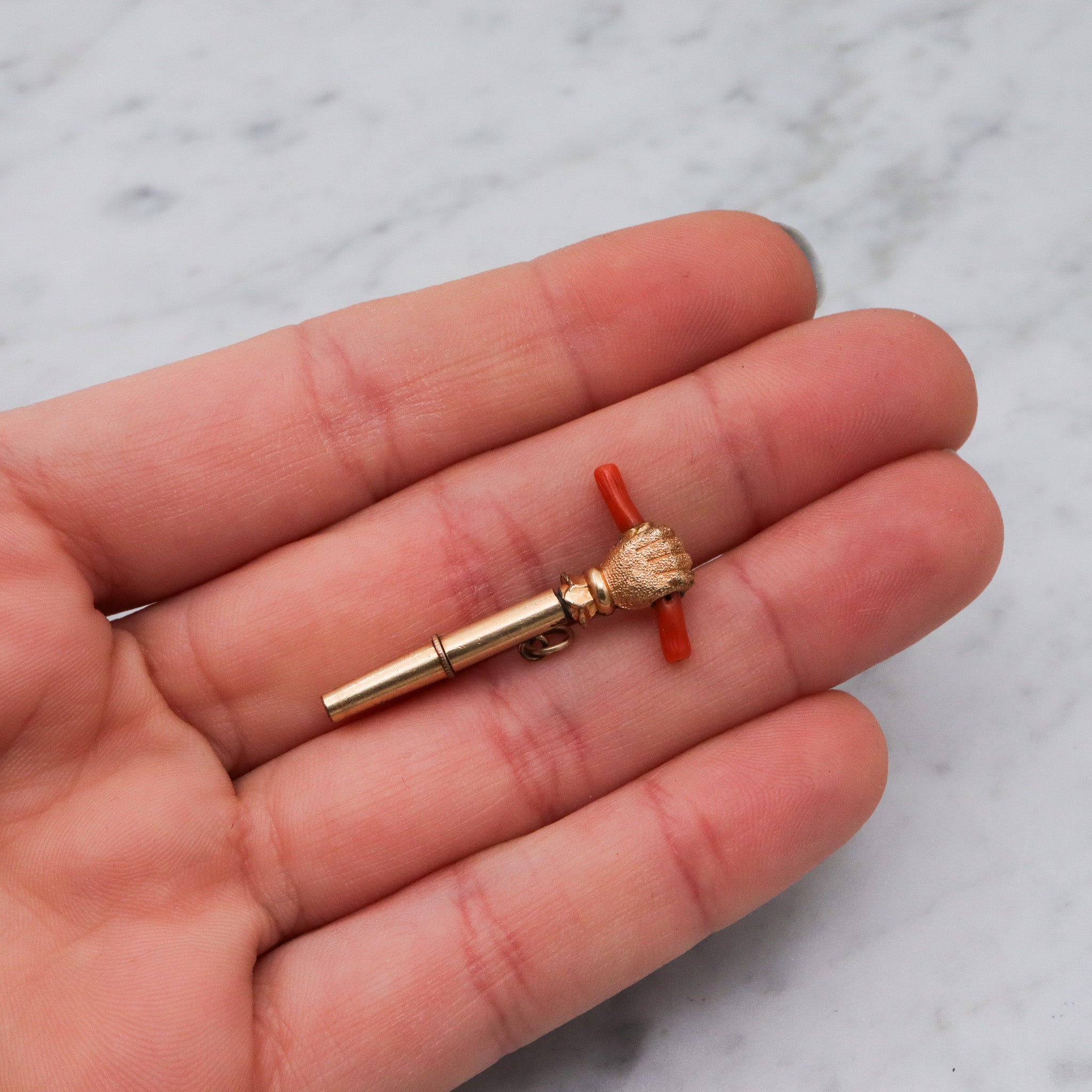 Antique Victorian gold filled raised fist with coral watch key fob